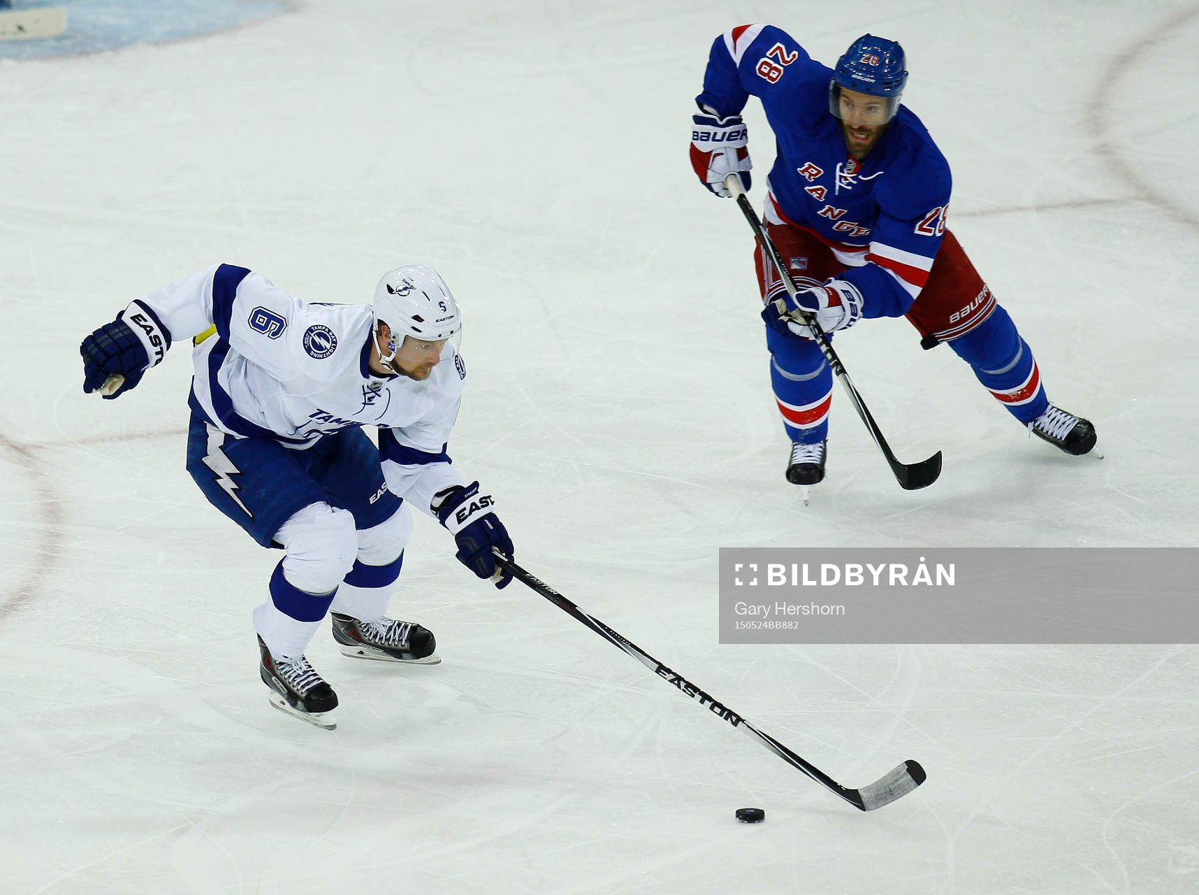 Tampa Bay Lightning Anton Stralman (L) skates away from New
