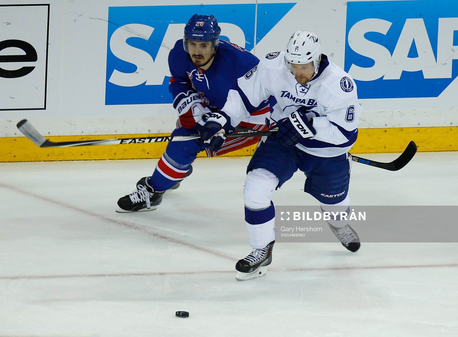 Tampa Bay Lightning Anton Stralman (R) skates away from New