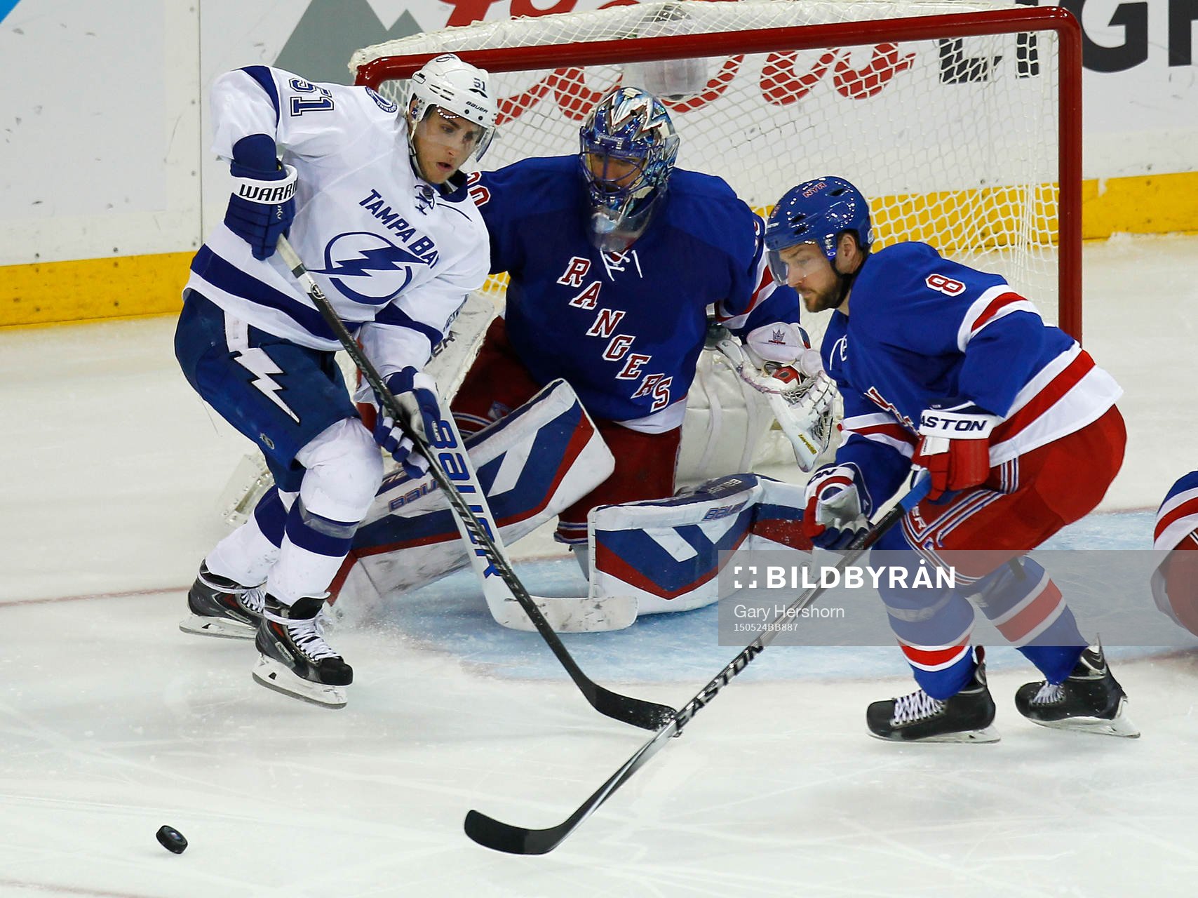 New York Rangers goalie Henrik Lundqvist (C) mmakes a save