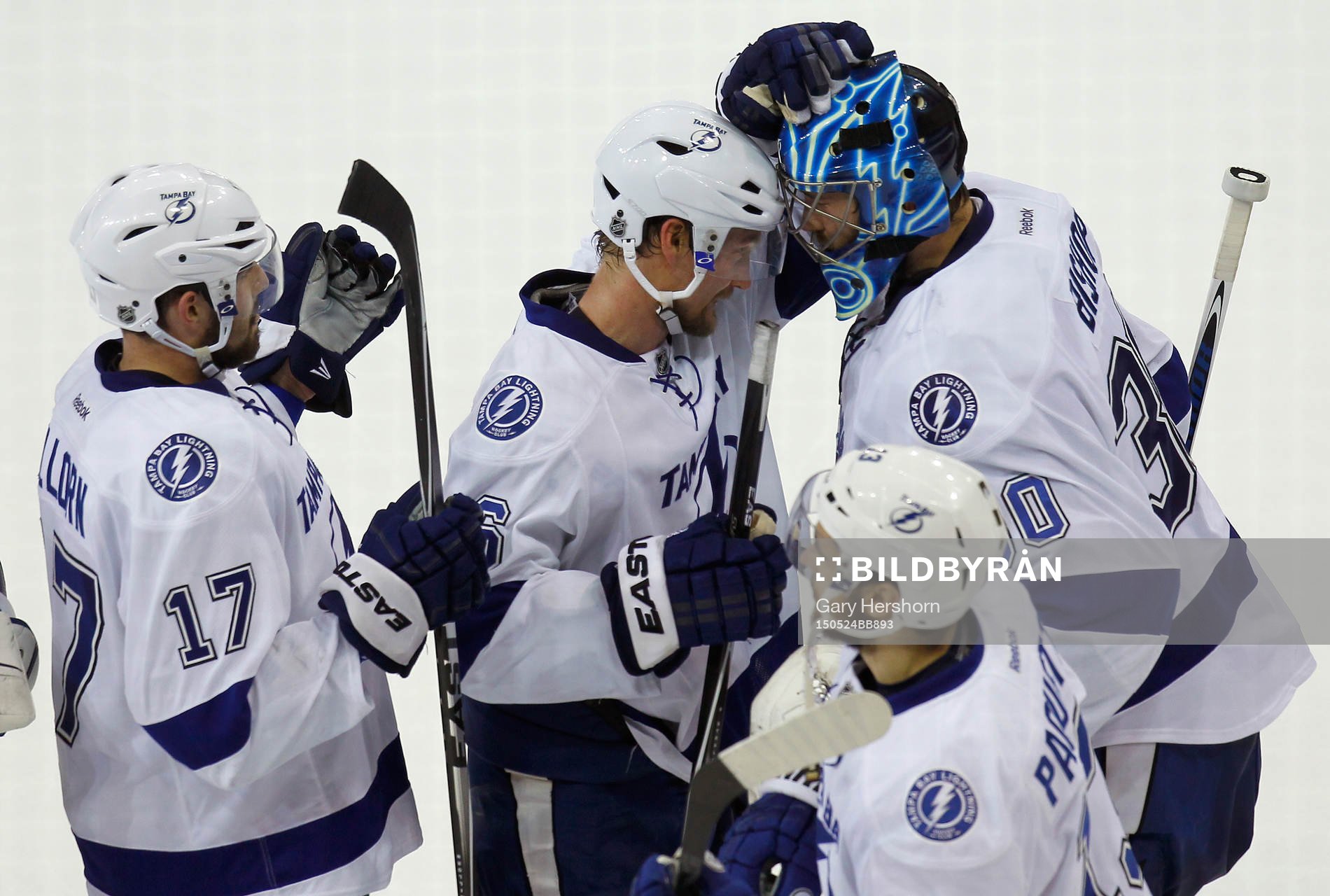 Tampa Bay Lightning goalie Ben Bishop (R) bumbs heads with
