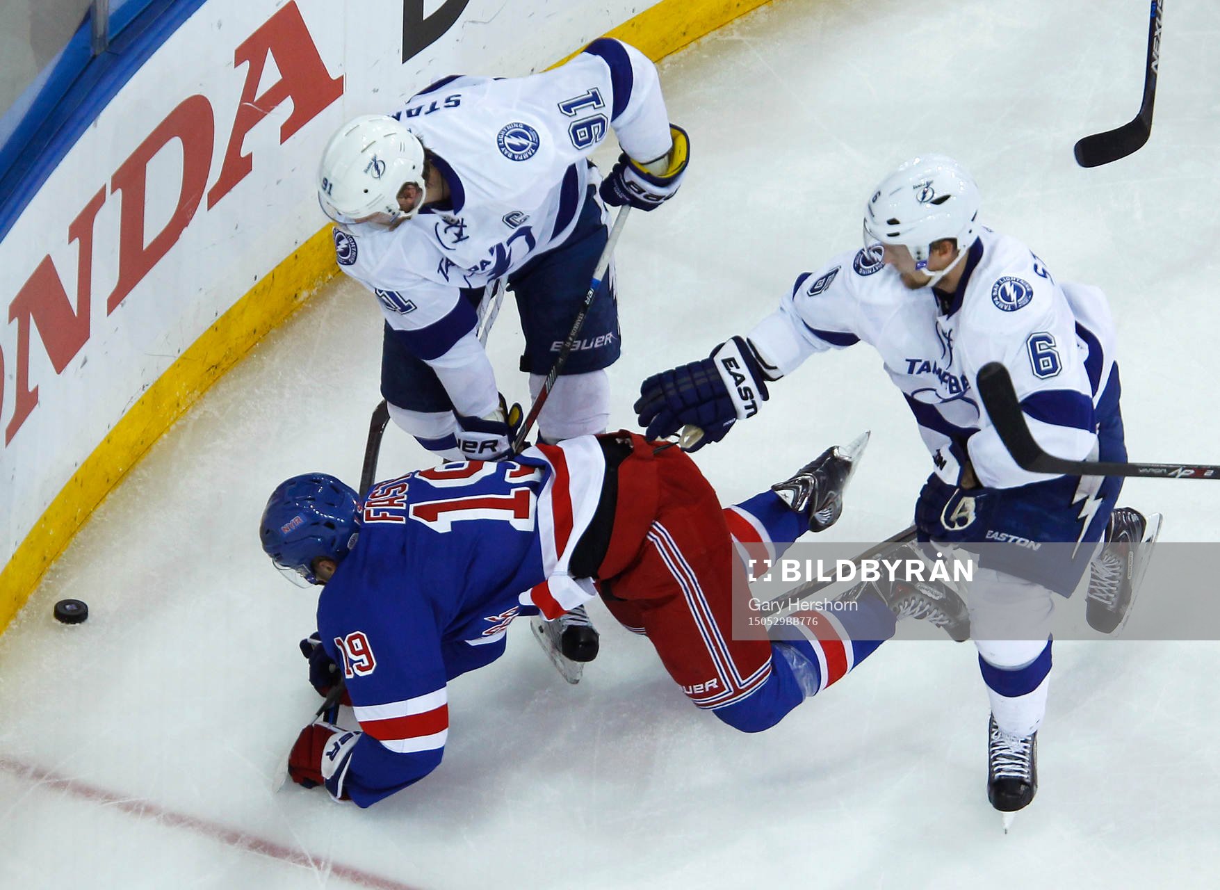 New York Rangers Jesper Fast (19) is knocked to the ice by