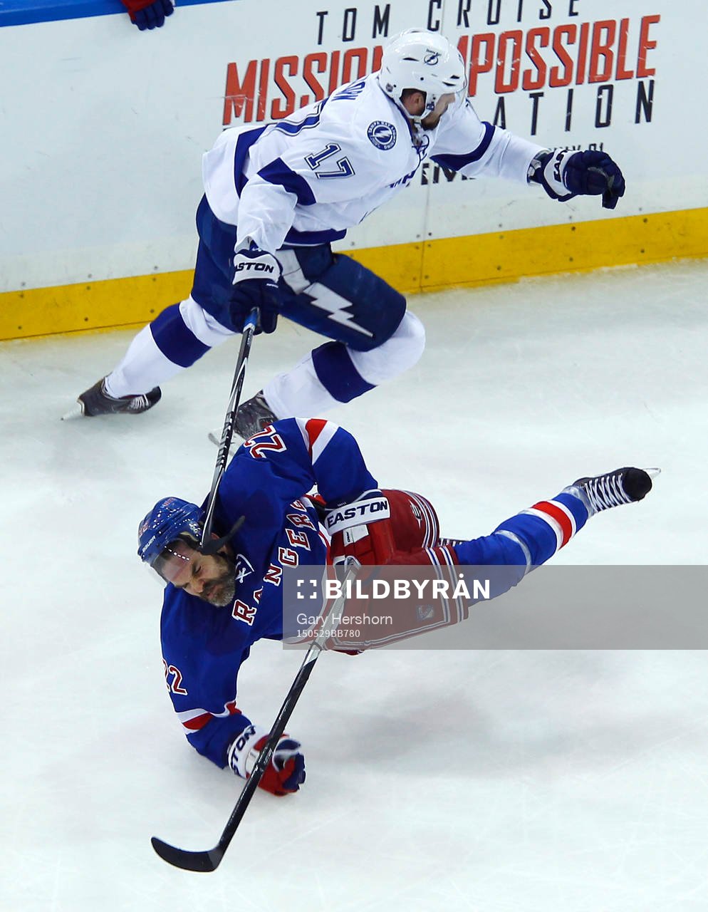 New York Rangers Dan Boyle (22) is knocked to the ice by