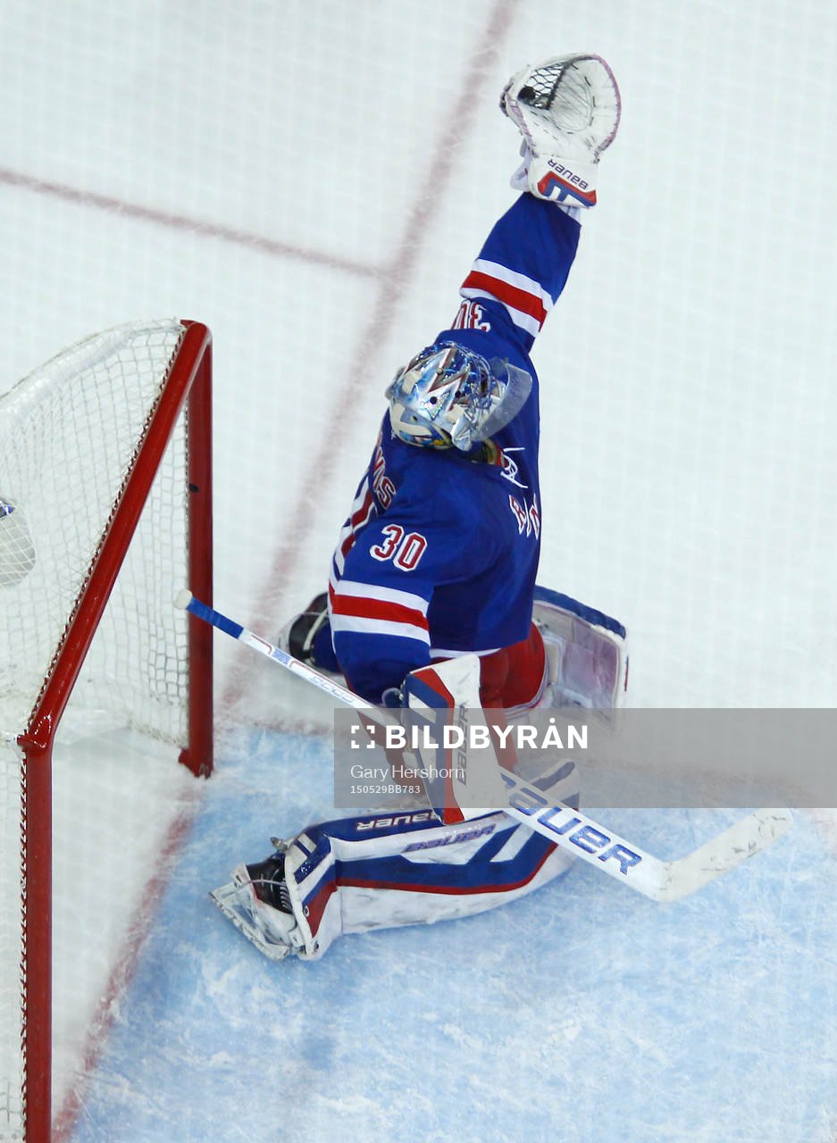 New York Rangers goalie Henrik Lundqvist makes a glove save