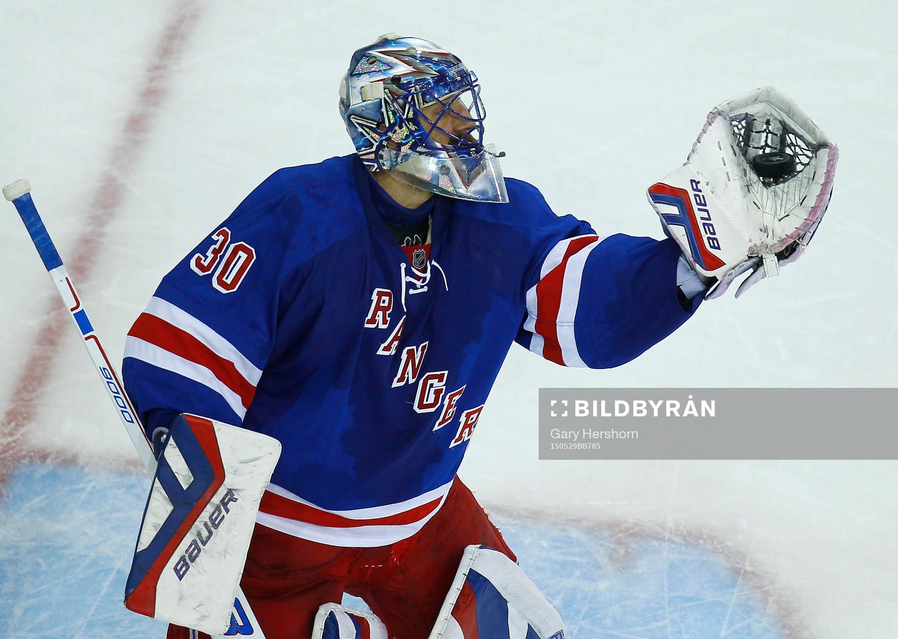 New York Rangers goalie Henrik Lundqvist makes a glove save