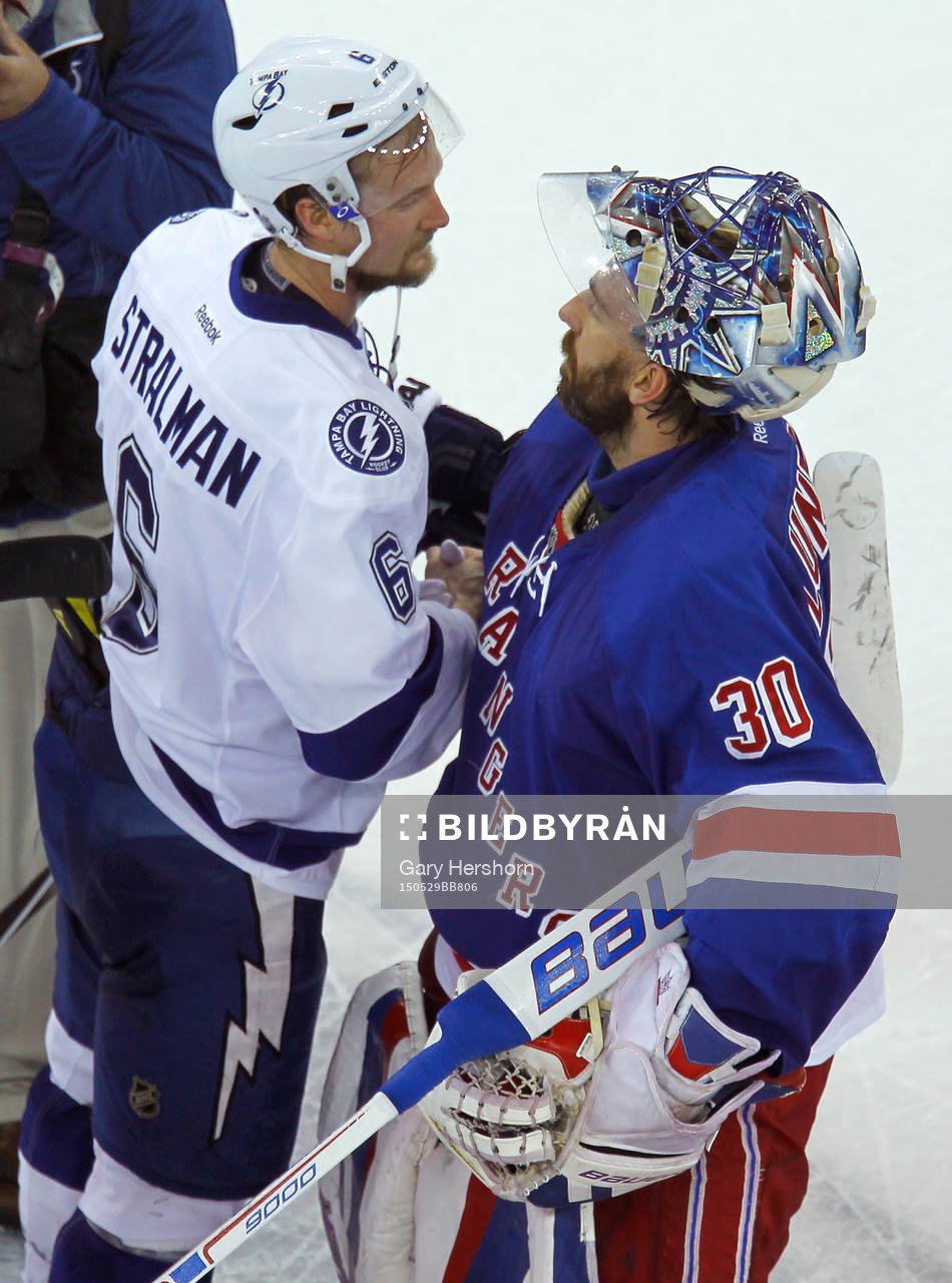 Tampa Bay Lighting Anton Stralman (L) shakes hands with New