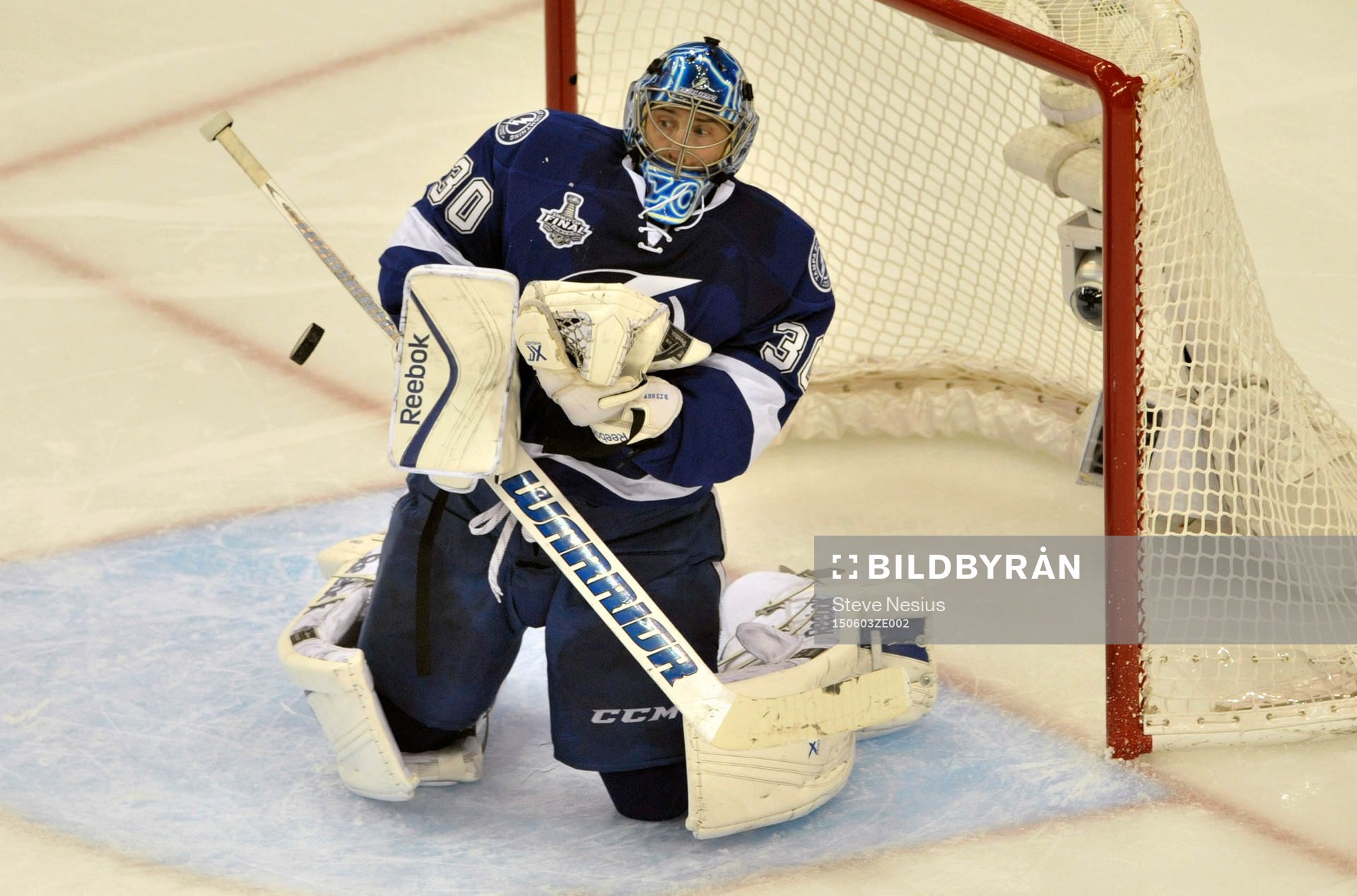 The Lightning's Ben Bishop deflects a shot