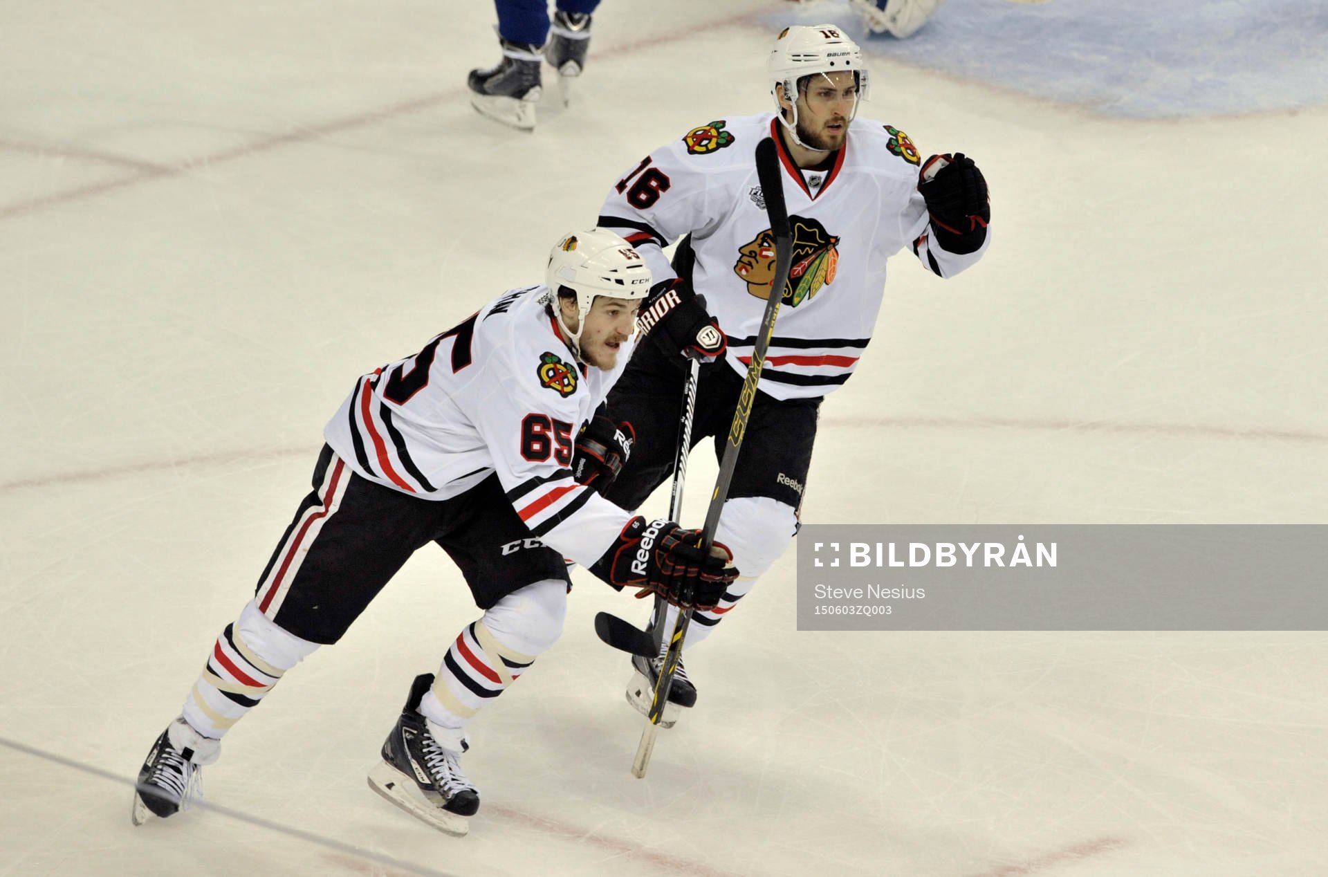 The Blackhawks' Andrew Shaw (65) and Marcus Kruger (16)