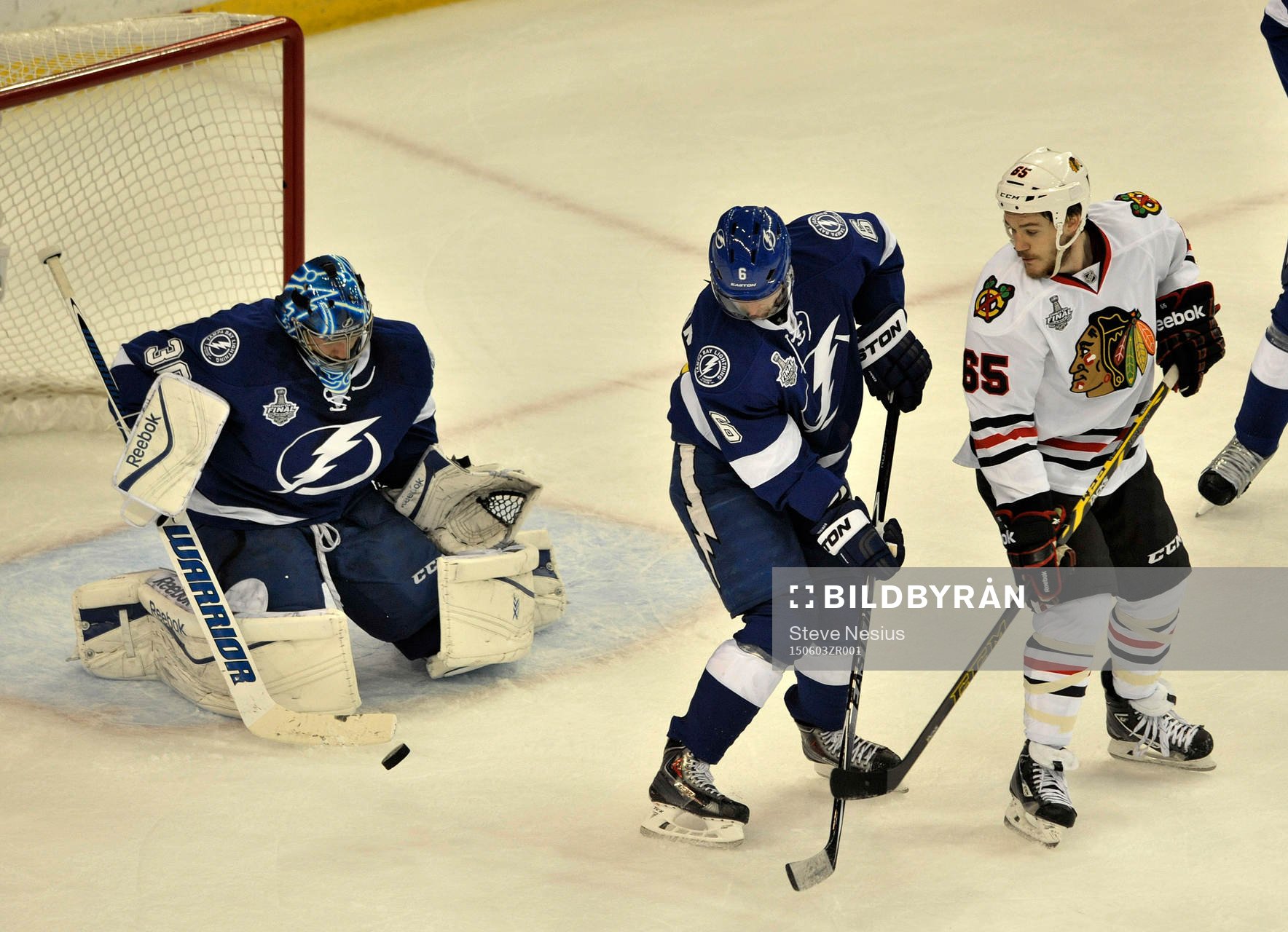 The Lightning's Anton Strålman (6) helps goalie Ben Bishop