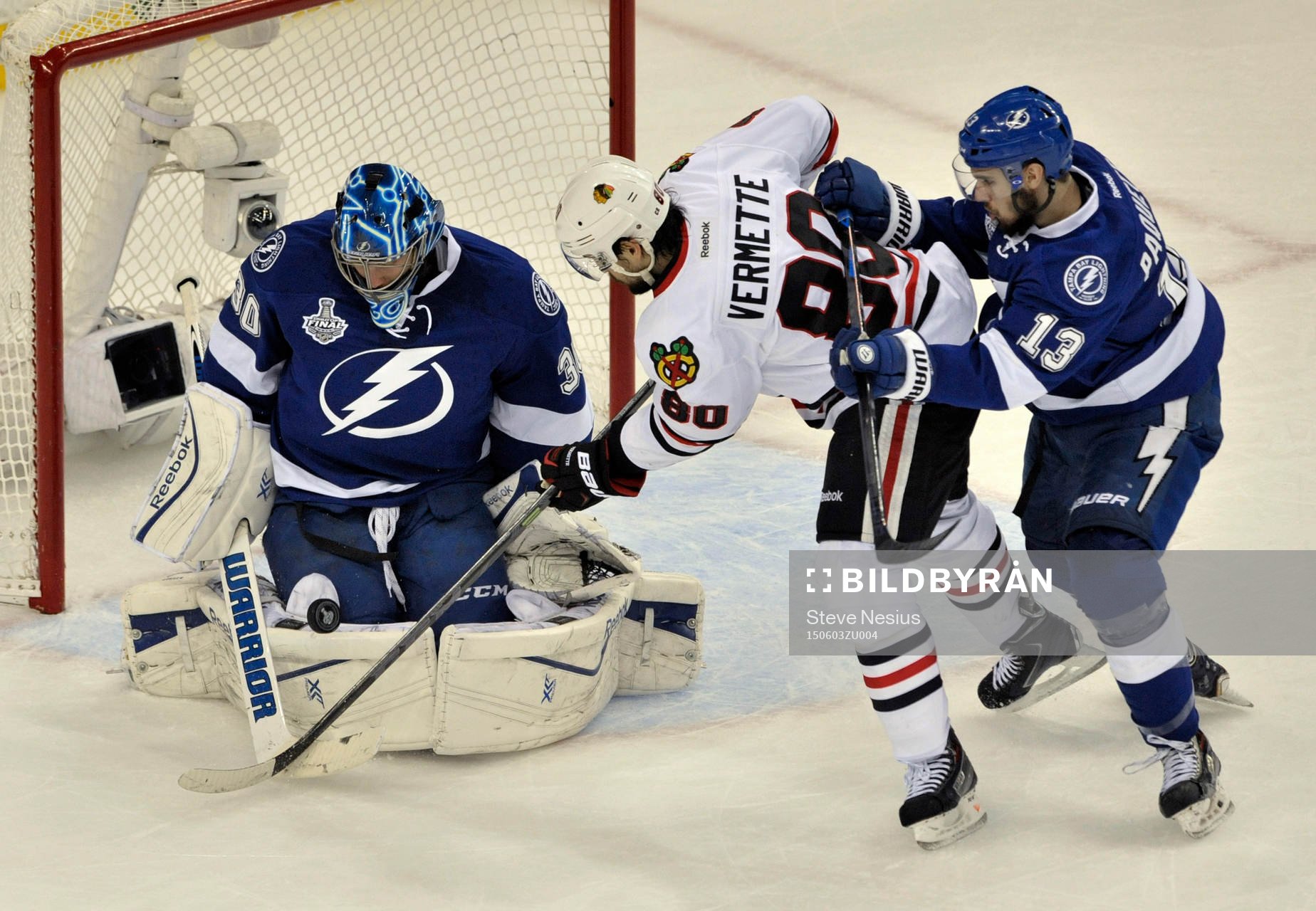 The Lightning's Ben Bishop (30) stops a shot from the