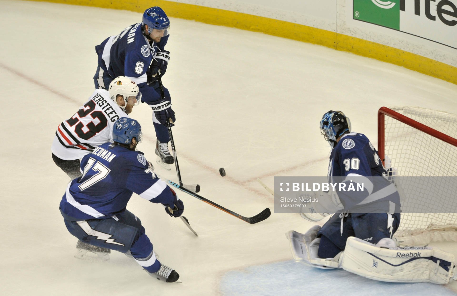 The Lightning's Ben Bishop (30) deflects a shot by the