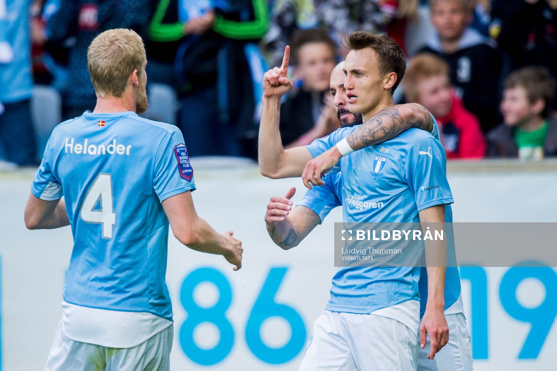 Malmö FFs Magnus Wolff Eikrem kramas om av Guillermo Molins och Filip Helander efter han gjort 1-1 under fotbollsmatchen i Allsvenskan mellan Malmö FF och Djurgården den 7 juini 2015 i Malmö.