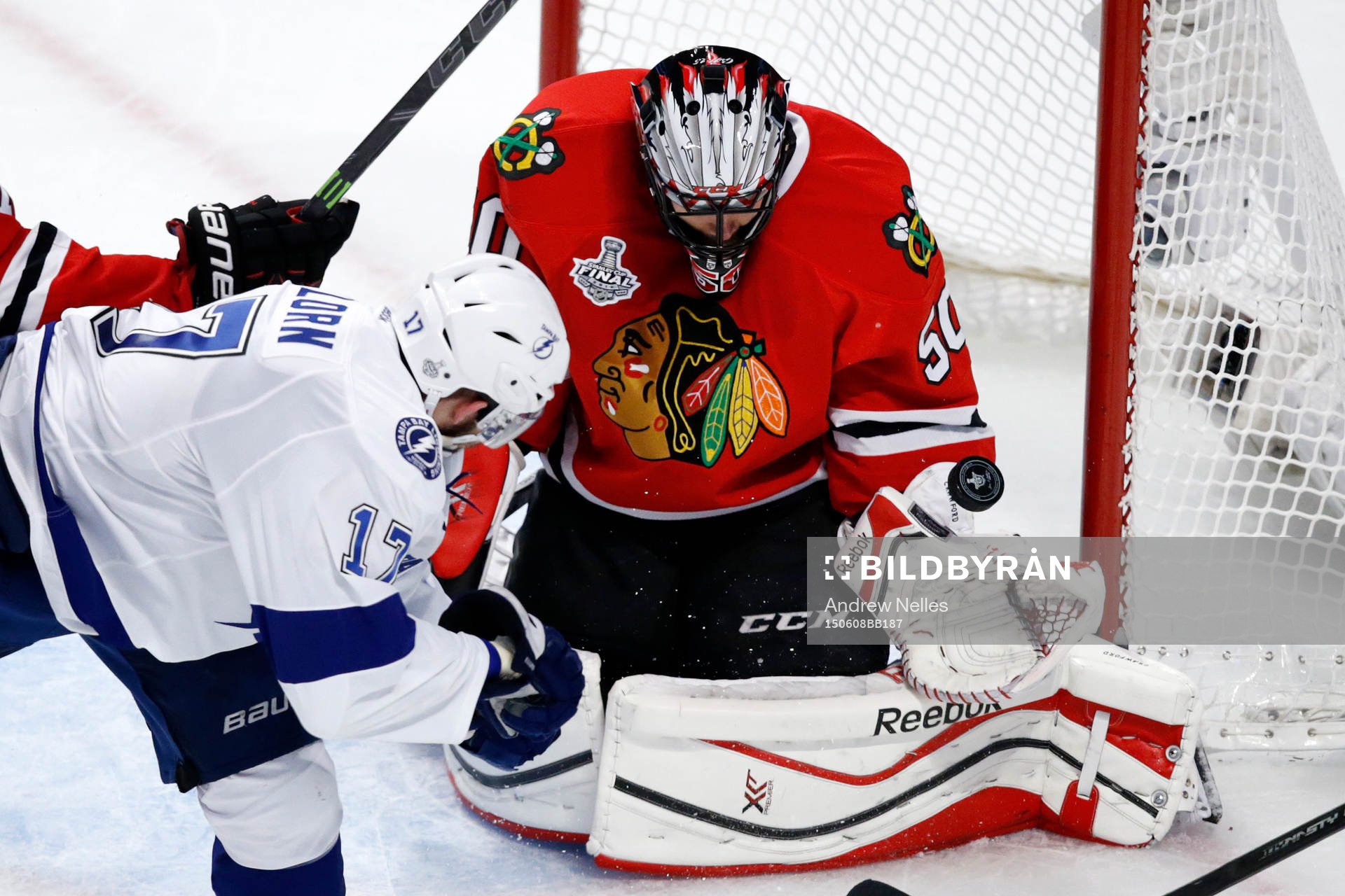 Chicago Blackhawks goalie Corey Crawford (50) deflects a