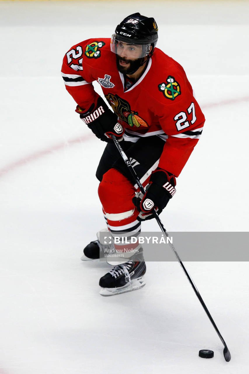 Chicago Blackhawks defenseman Johnny Oduya (27) skates with