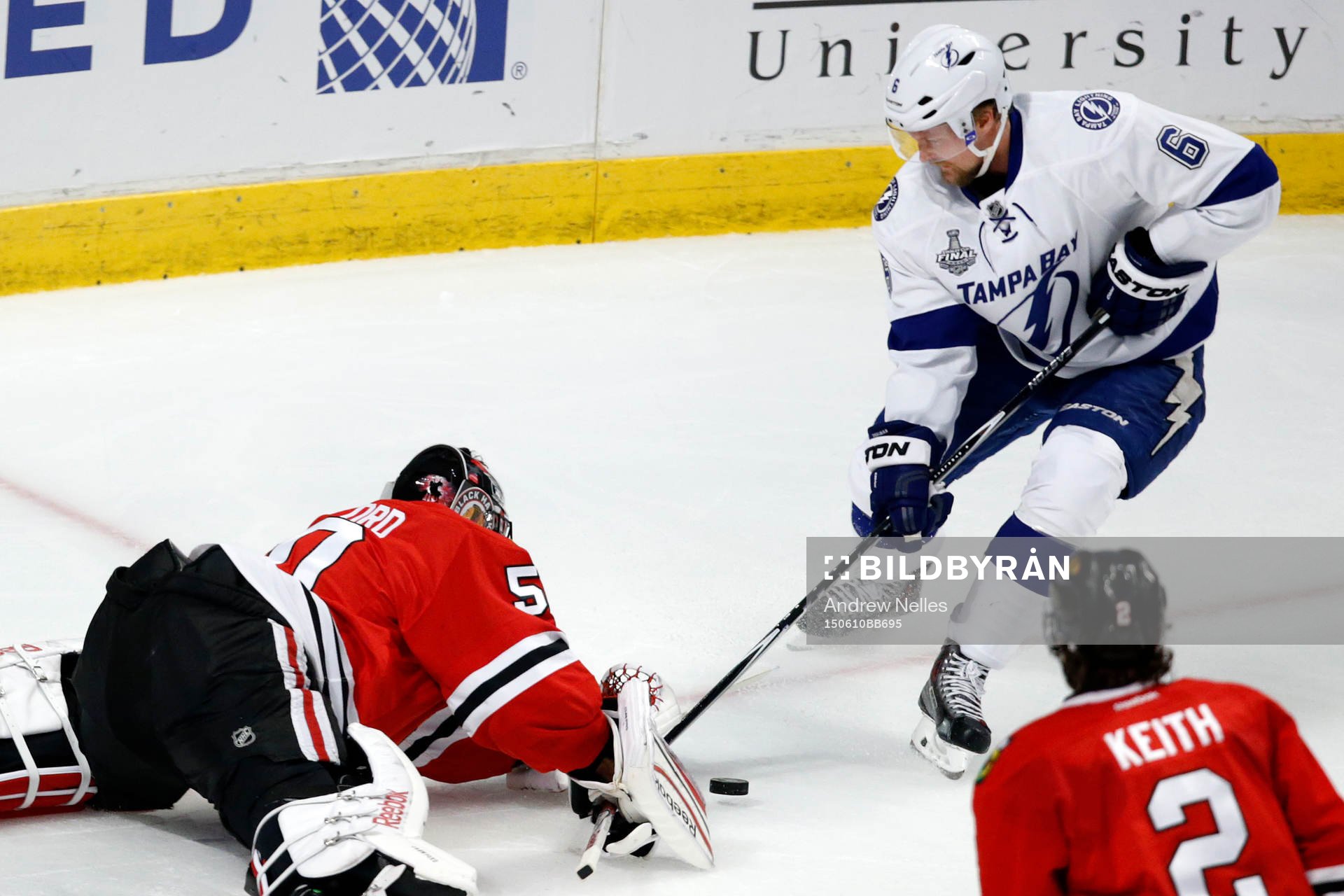 Chicago Blackhawks goalie Corey Crawford (50) deflects a