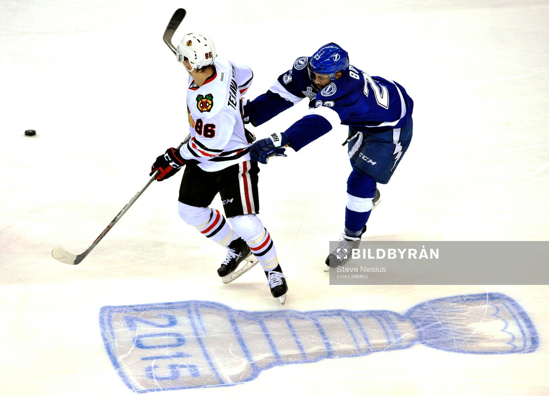 Tampa Bay's J.T. Brown (23) checks Chicago's Teuvo