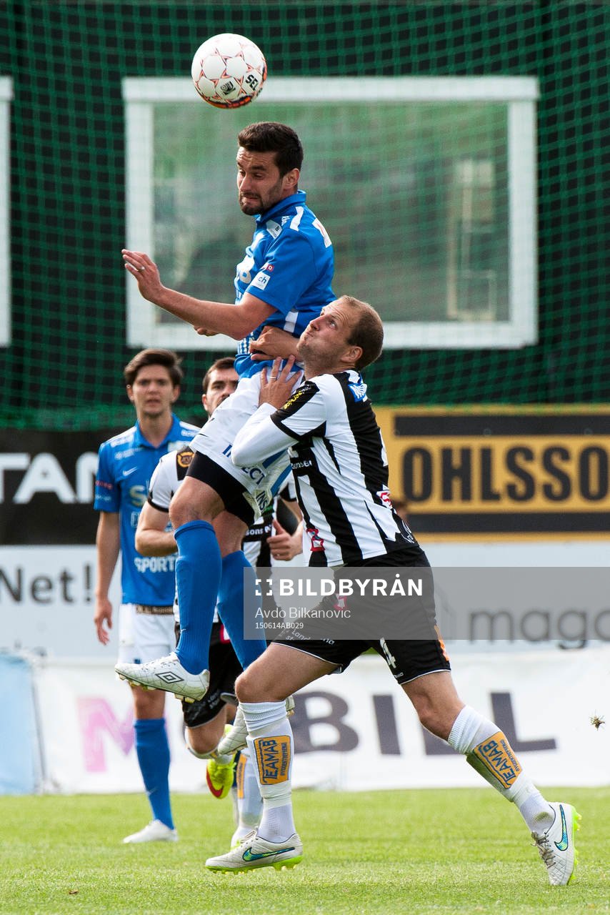 Landskronas Mikael Dahlgren trycker bort Norrbys Elmin Kurbegovic under fotbollsmatchen i Div 1 Södra Götaland mellan Landskrona BoIS och Norrby den 14 juni 2015 i Landskrona