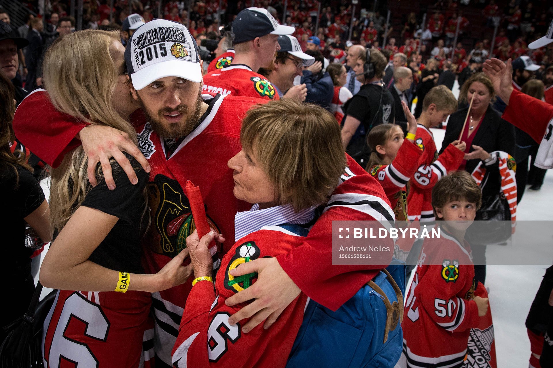 Chicago Blackhawks center Marcus Kruger (16) hugs friends