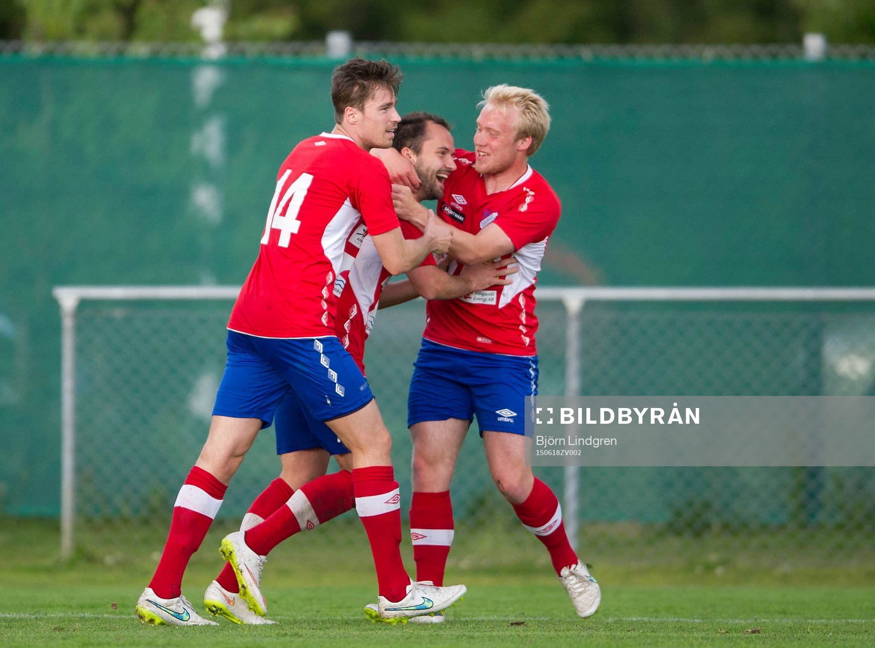 Höganäs Kastriot Sogojeva jublar efter sitt andra mål med Boris Vidovic och Marcus Karlsson under fotbollsmatchen i div 2 västra götaland mellan Höganäs BK och Högaborgs BK den 18 juni 2015 i Höganäs.
