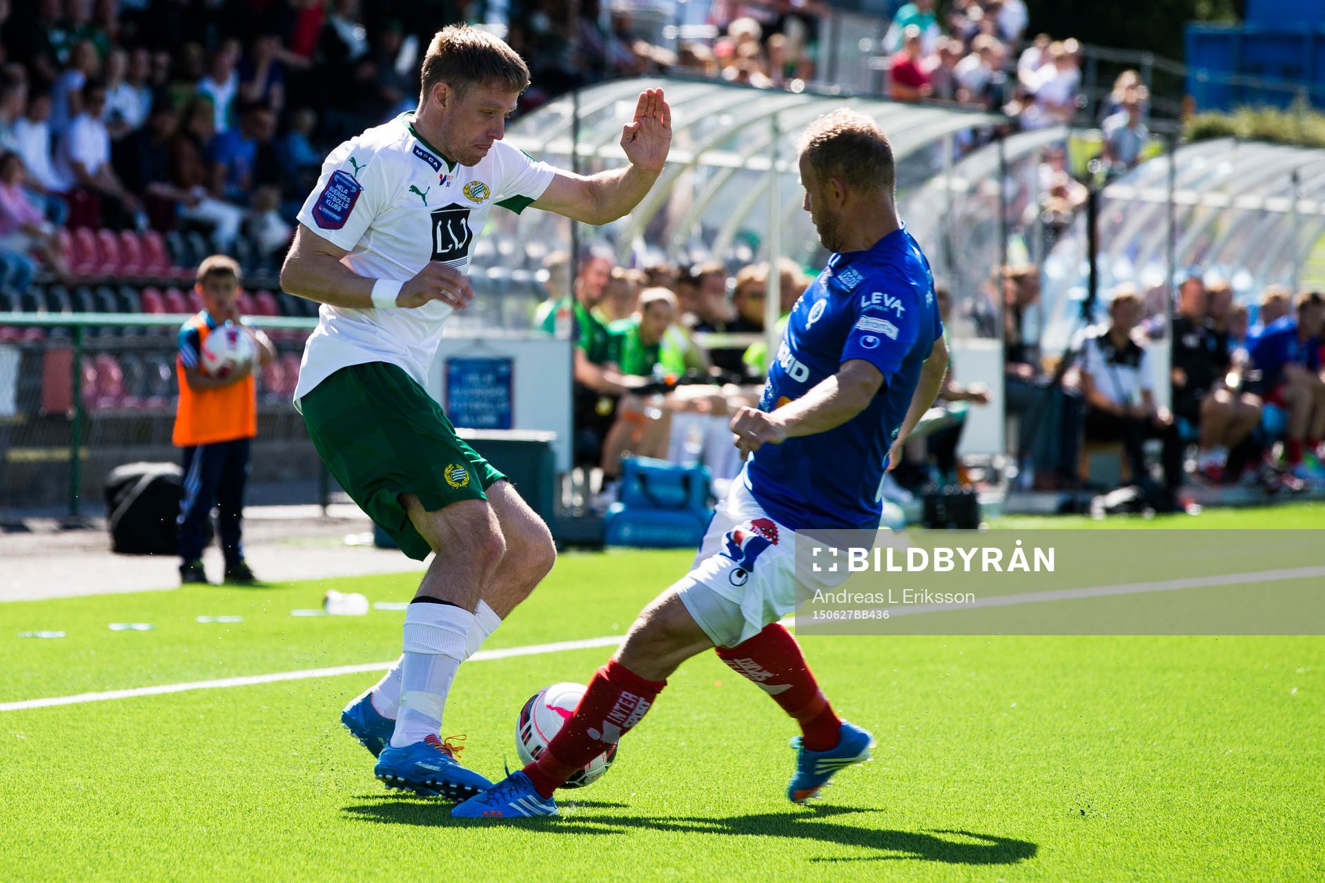 Hammarbys Jan Gunnar Solli i kamp om bollen med Åtvidabergs Kristian Bergström under en träningsmatch i fotboll mellan Hammarby och Åtvidaberg den 27 juni 2015 i Stockholm.