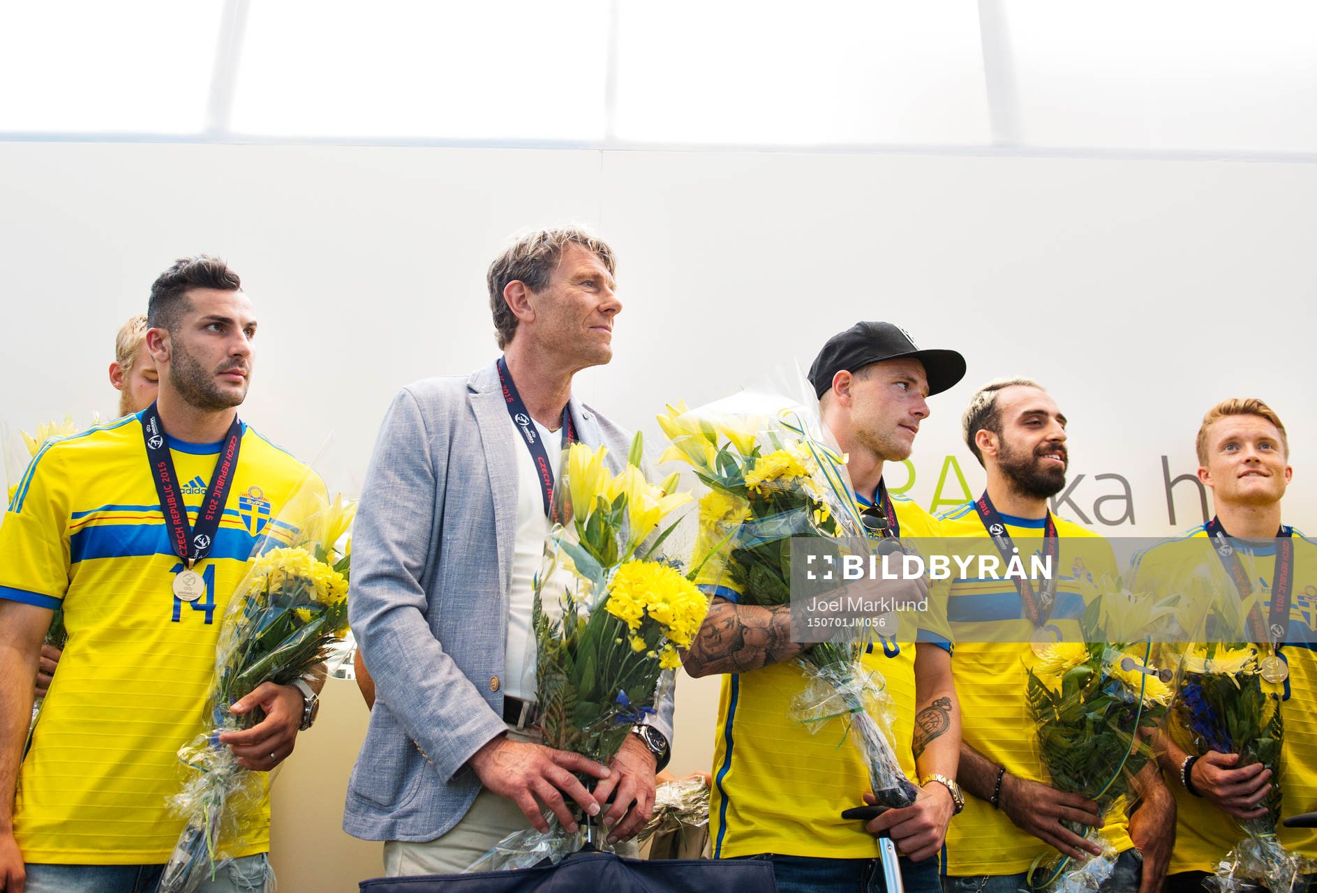 Mikael Ishak, förbundskapten Håkan Ericson, John