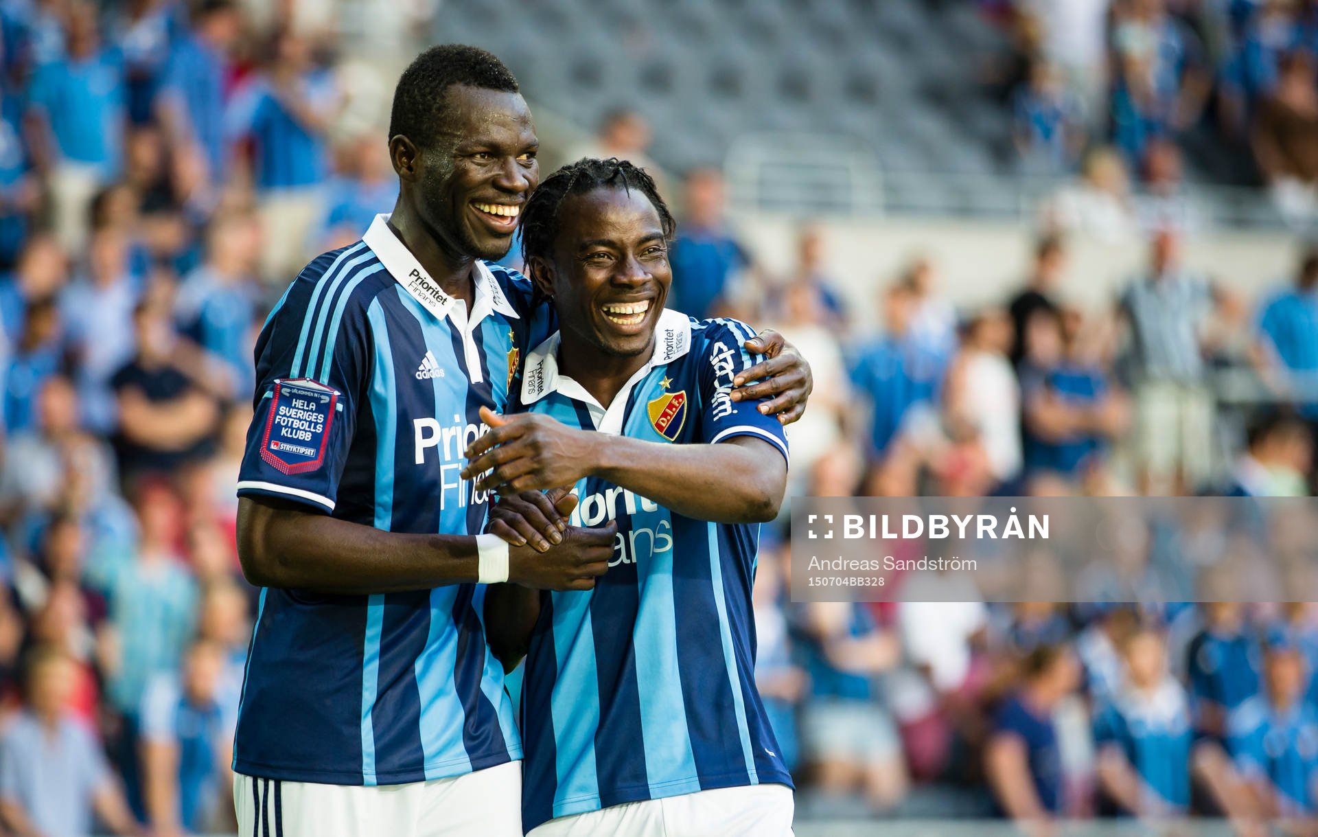 Djurgårdens Omar Colley (v) och 2-0 målskytten Sam Johnson (h) ser glada ut efter fotbollsmatchen i Allsvenskan mellan Djurgården och Örebro och 4 Juli 2015 i Stockholm.