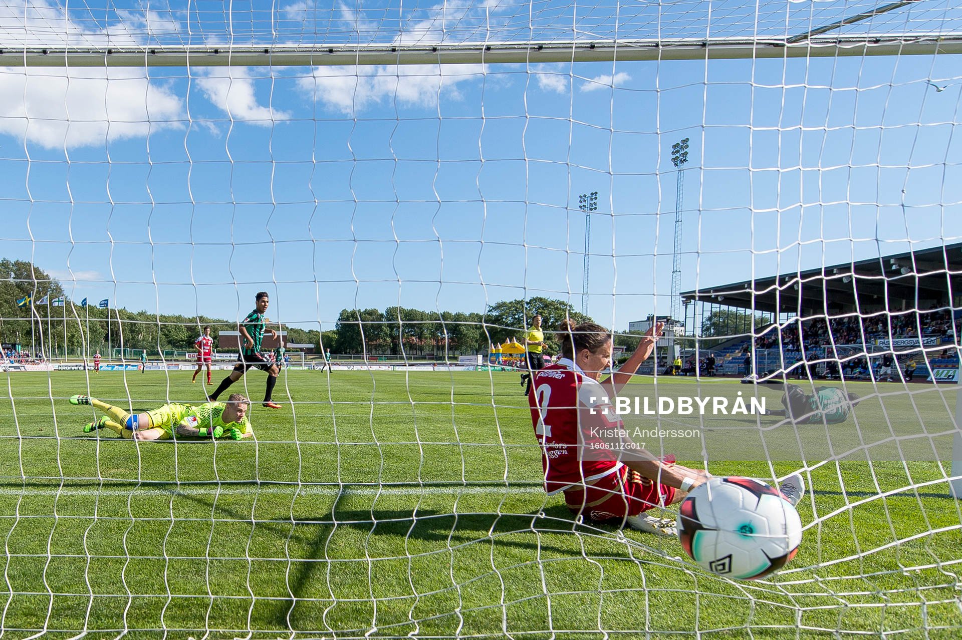 Varbergs Nsima Peter gör 2-0 och Degerfors målvakt Jesse Öst ser på när Jonathan Azulay försöker stoppa bollen under fotbollsmatchen i Superettan mellan Varberg och Degerfors den 11 juni 2016 i Varberg.