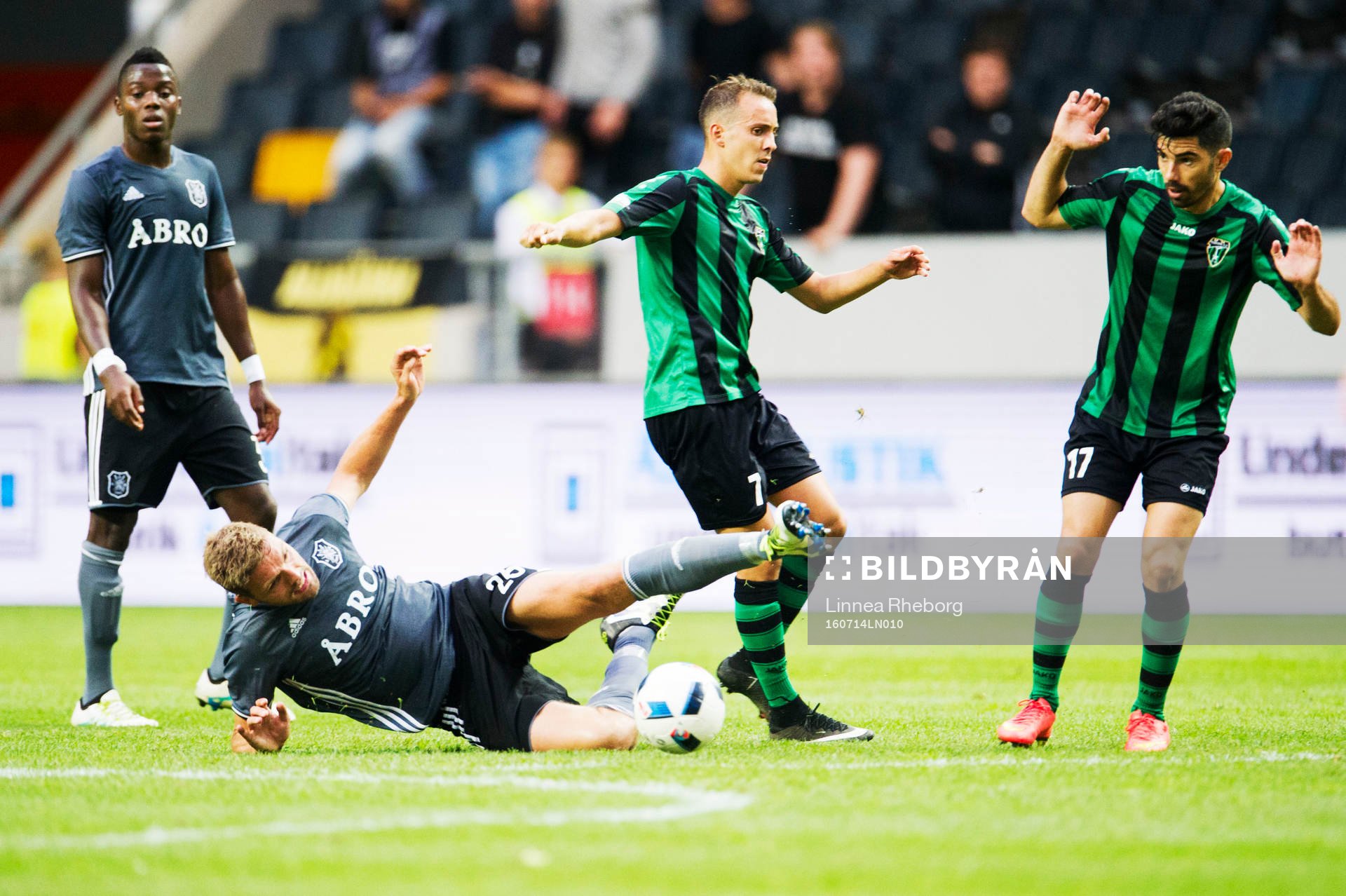 Europa FC:s Toni García håller fast Jos Hooiveld under fotbollsmatchen i det andra kvalet till Europa League mellan AIK och Europa FC den 14 juli 2016 i Stockholm.