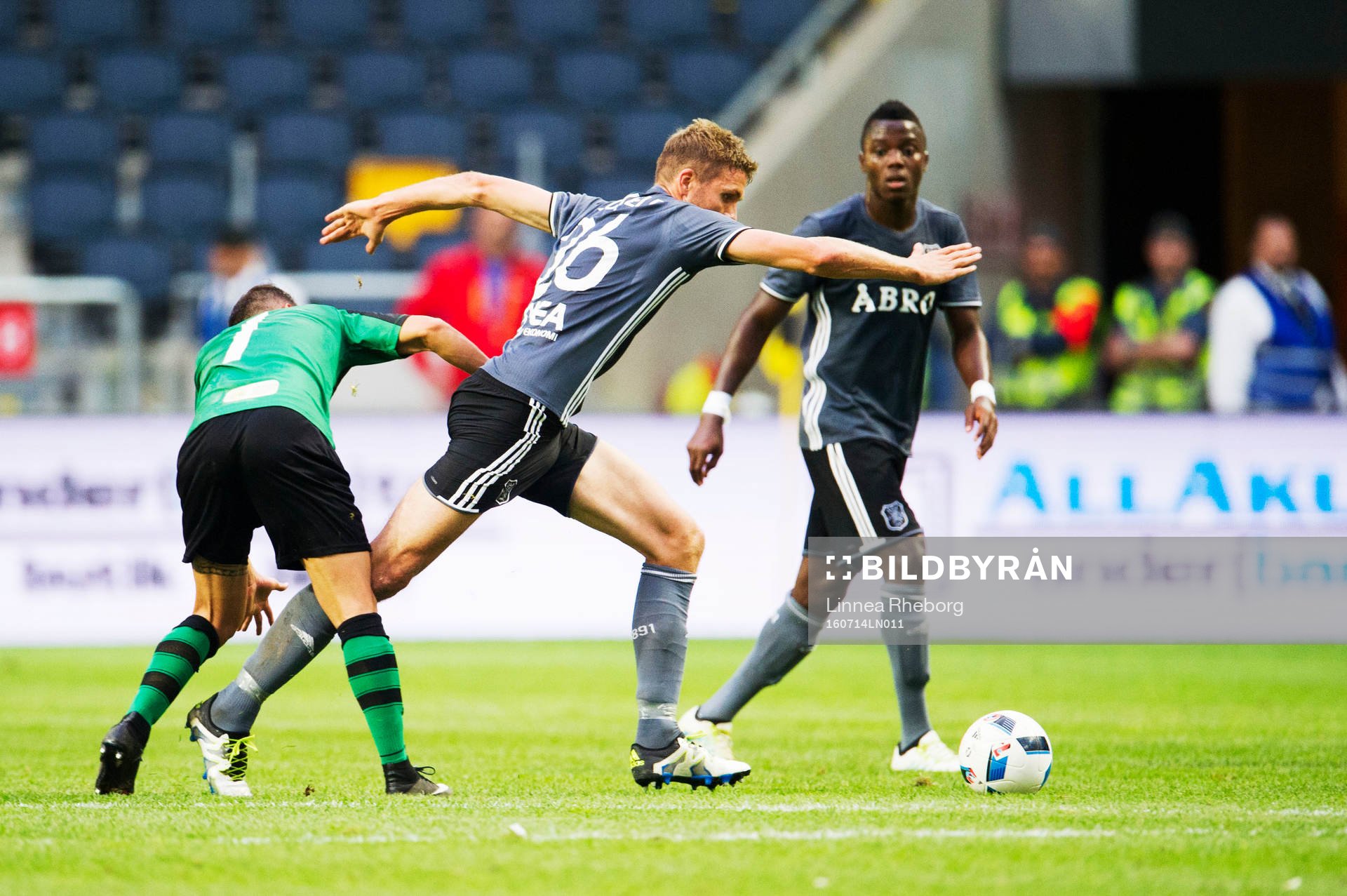 Europa FC:s Toni García håller fast Jos Hooiveld under fotbollsmatchen i det andra kvalet till Europa League mellan AIK och Europa FC den 14 juli 2016 i Stockholm.