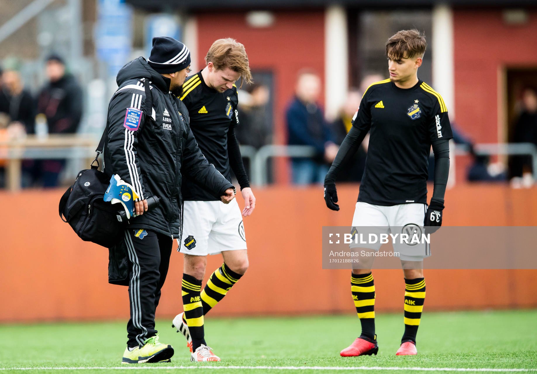 AIK:s Johan Blomberg skadar sig och går av planen med sjukvårdare under en träningsmatch i fotboll mellan Vasalund och AIK den 21 Januari 2017 i Stockholm.