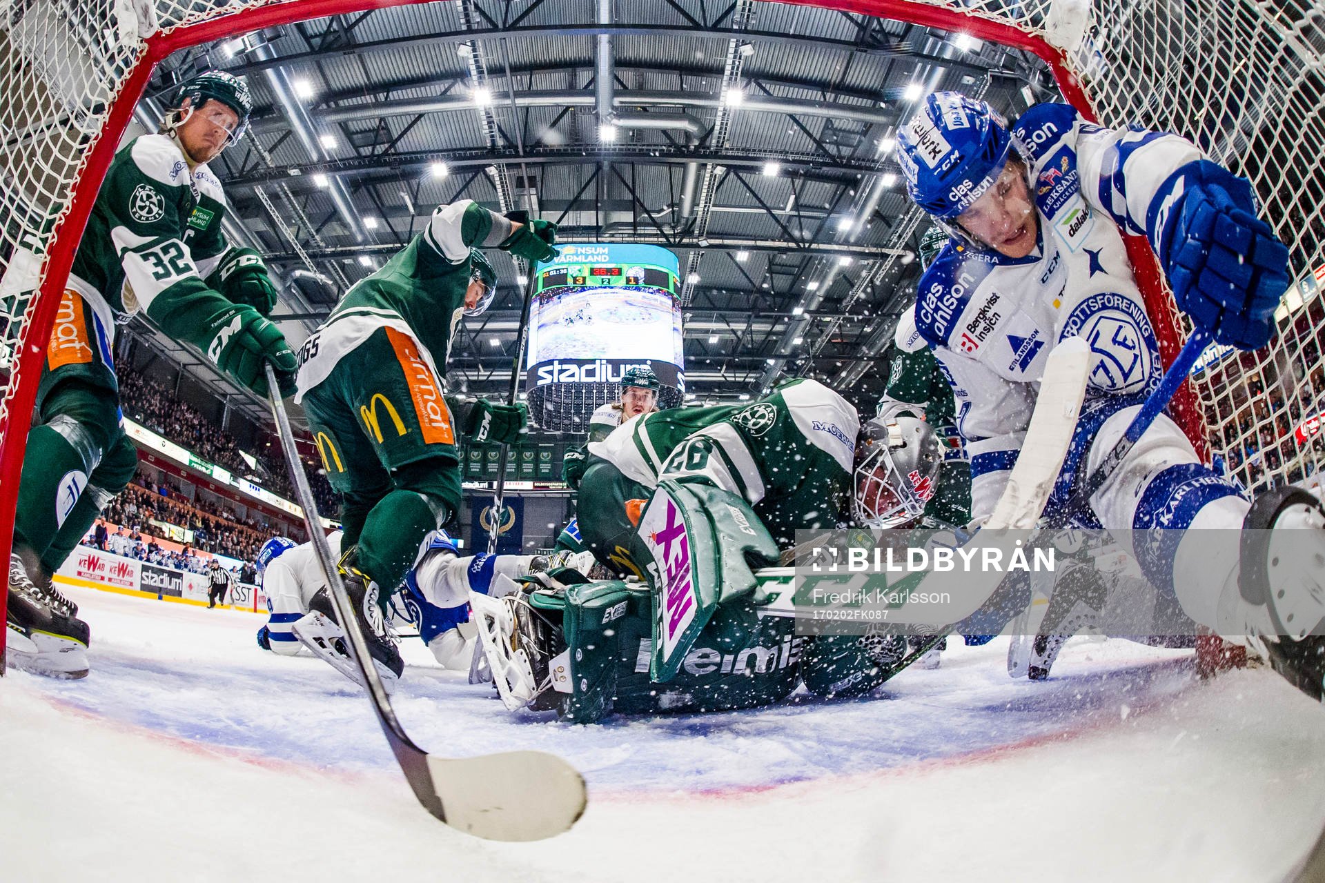Färjestads Magnus Nygren, målvakt Stefan Steen och