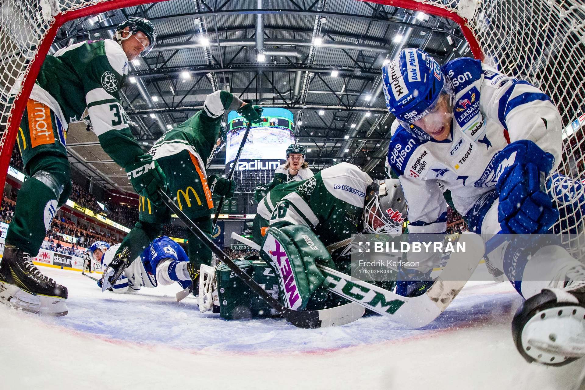 Färjestads Magnus Nygren, målvakt Stefan Steen och