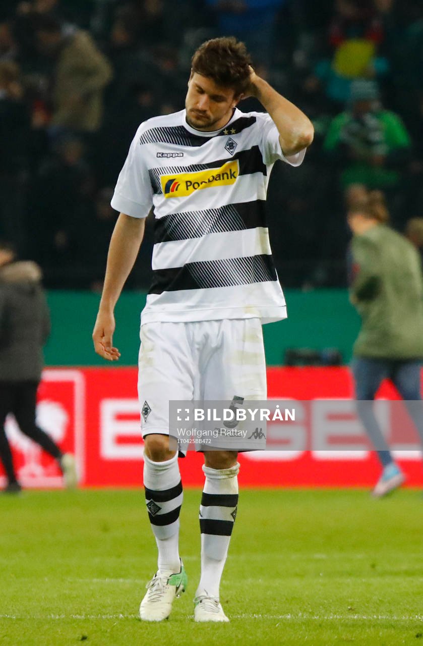 Football Soccer - Borussia Monchengladbach v Eintracht Frankfurt - DFB Pokal Semi Final - Borussia-Park, Monchengladbach, Germany - 25/4/17 Borussia Monchengladbach's Tobias Strobl looks dejected after losing the match with a penalty shootout Reuters / Wolfgang Rattay Livepic DFL RULES TO LIMIT THE ONLINE USAGE DURING MATCH TIME TO 15 PICTURES PER GAME. IMAGE SEQUENCES TO SIMULATE VIDEO IS NOT ALLOWED AT ANY TIME. FOR FURTHER QUERIES PLEASE CONTACT DFL DIRECTLY AT + 49 69 650050 DFB RULES PROHIBIT USE IN MMS SERVICES VIA HANDHELD DEVICES UNTIL TWO HOURS AFTER A MATCH AND ANY USAGE ON INTERNET OR ONLINE MEDIA SIMULATING VIDEO FOOTAGE DURING THE MATCH.