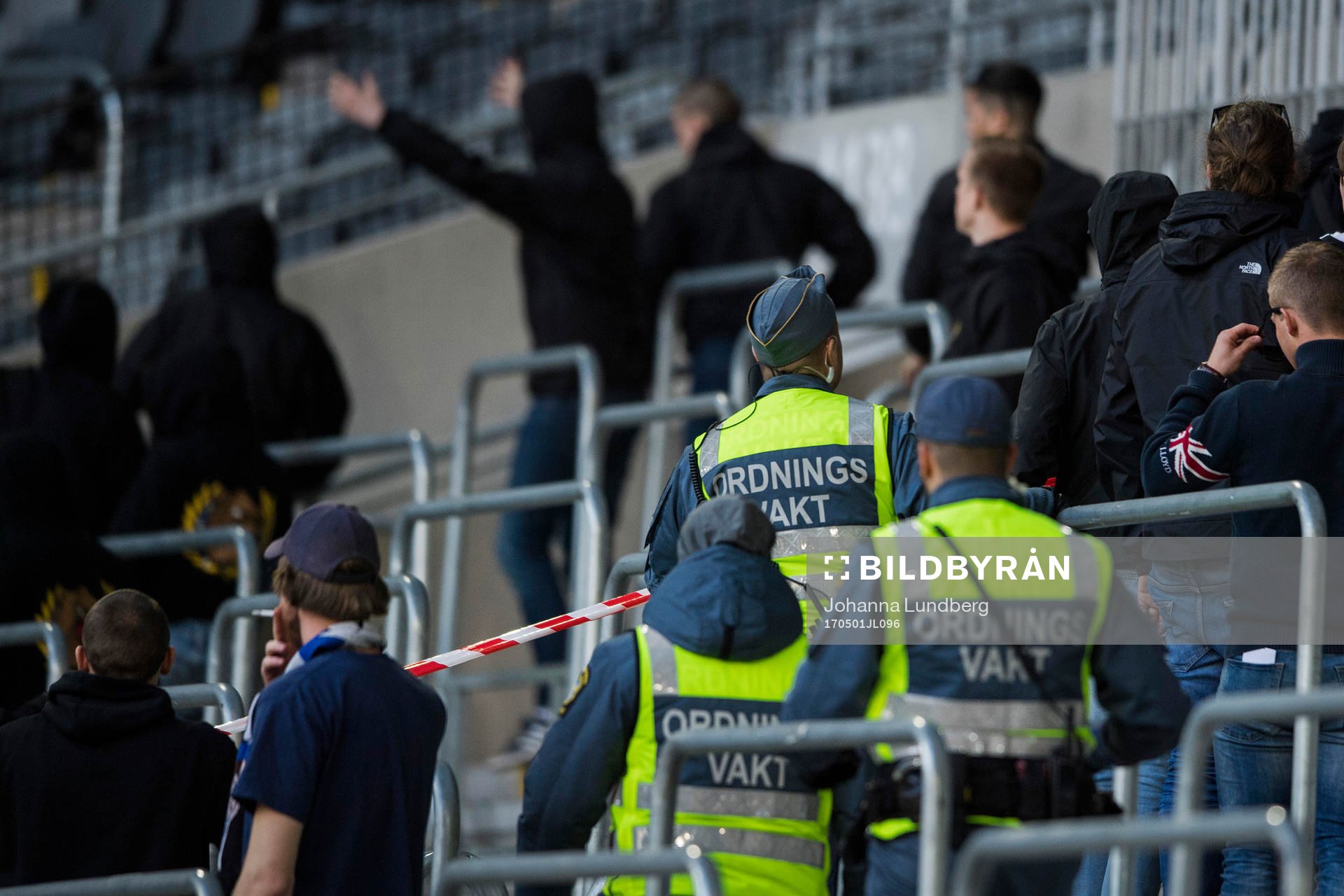 Ordningsvakter tar sig in på läktaren när det blir stökigt efter fotbollsmatchen i Allsvenskan mellan Djurgården och Norrköping den 1 maj 2017 i Stockholm.