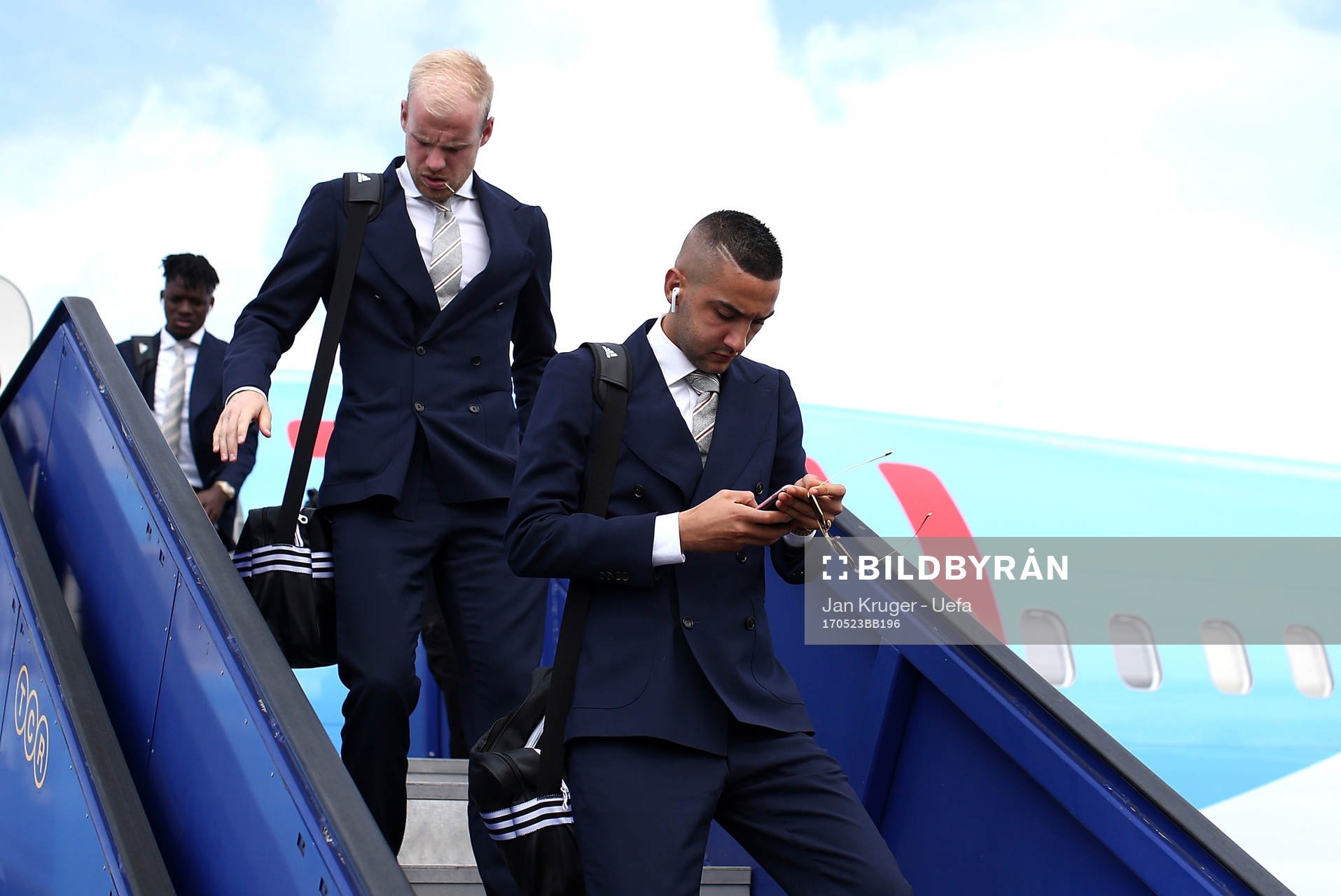 Davy Klaassen(L) and Hakim Ziyech of Ajax arrive