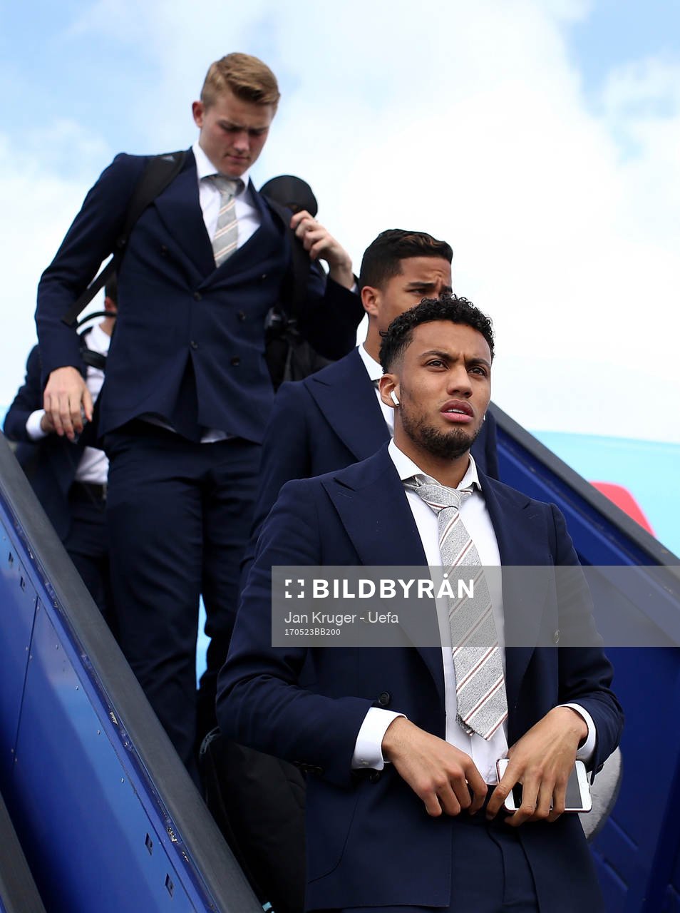 Jairo Riedewald of Ajax arrives with team mates