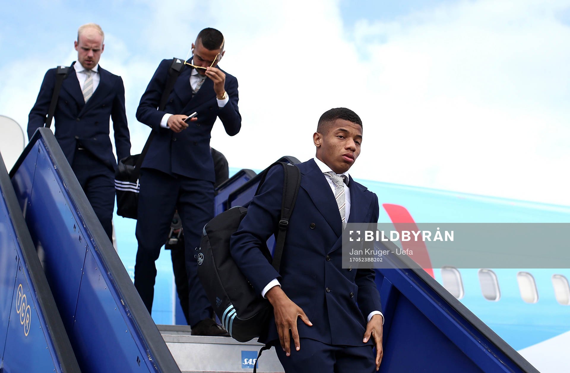 David Neres of Ajax arrives with team mates