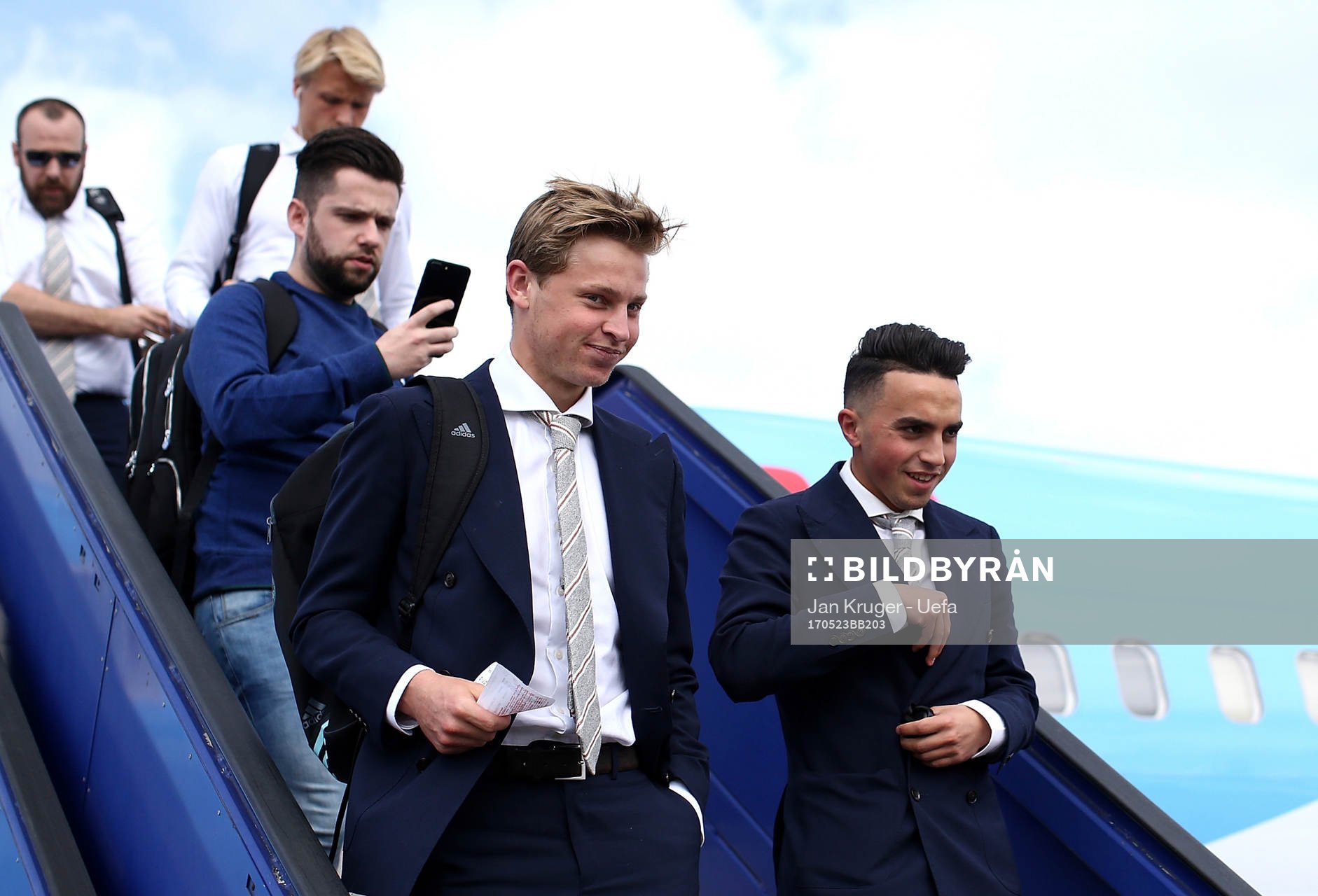 Frenkie de Jong(L) and ahead Abdelhak Nouri of Ajax arrive