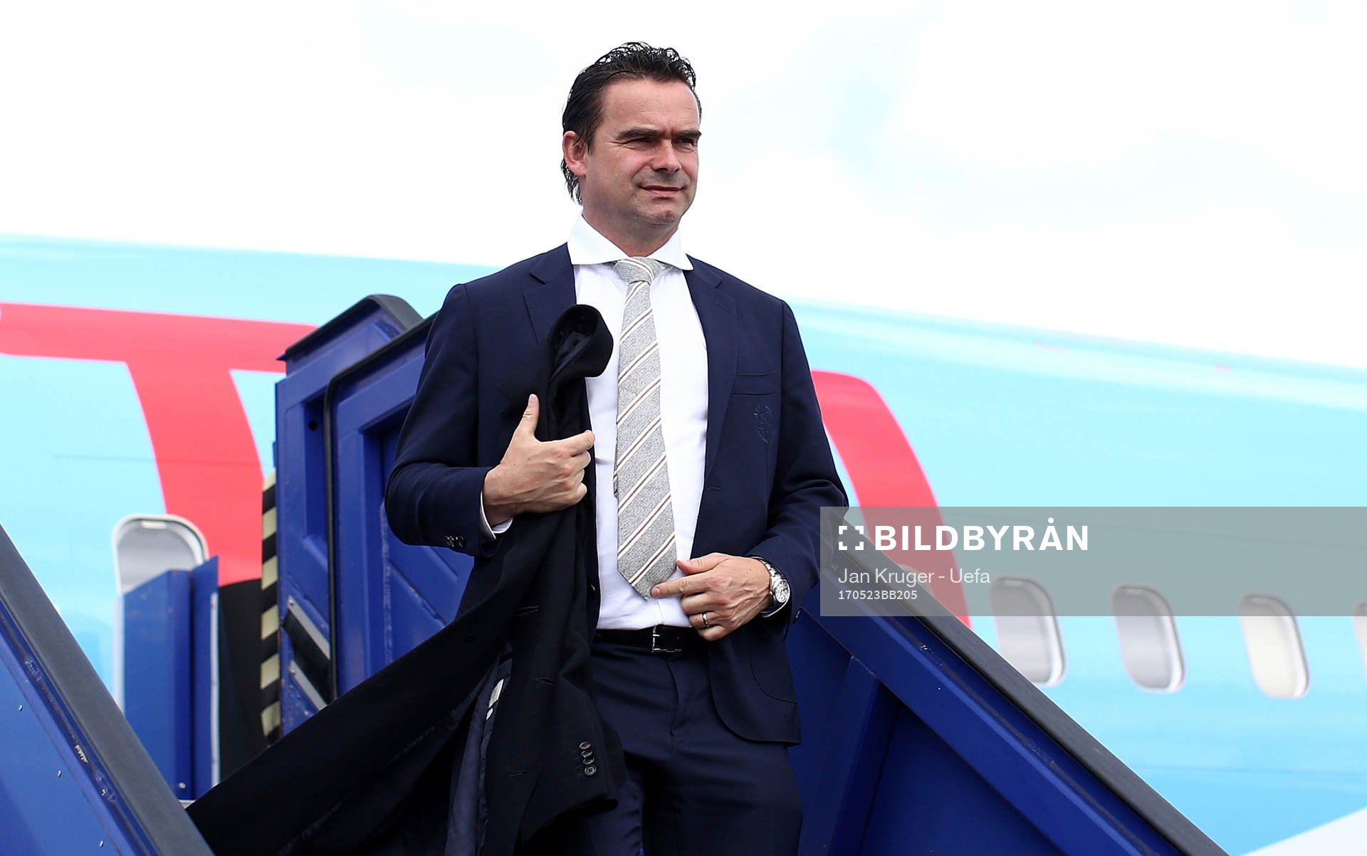 Marc Overmars arrives with the team