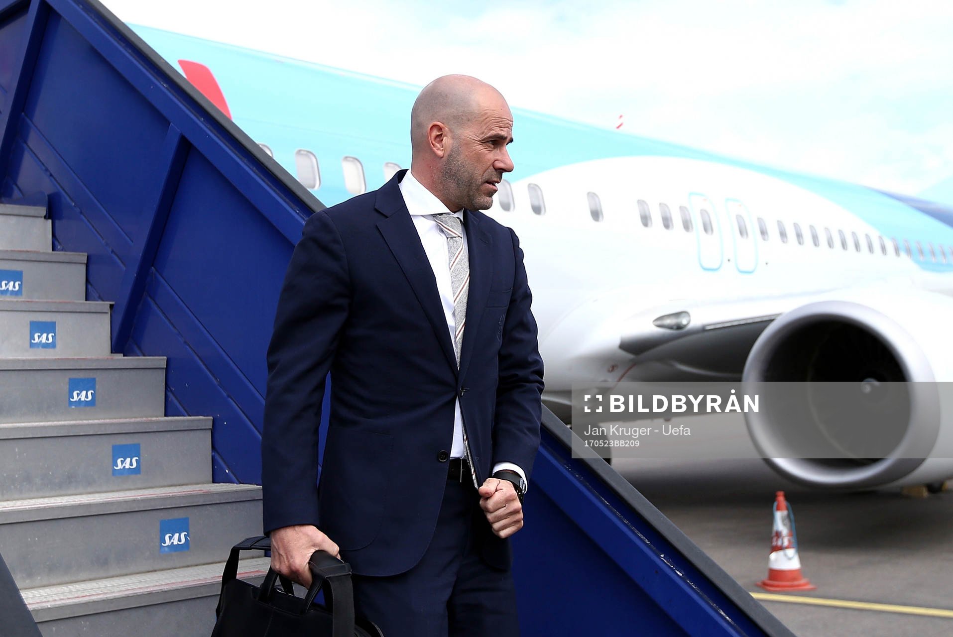 Ajax manager Peter Bosz arrives with his team