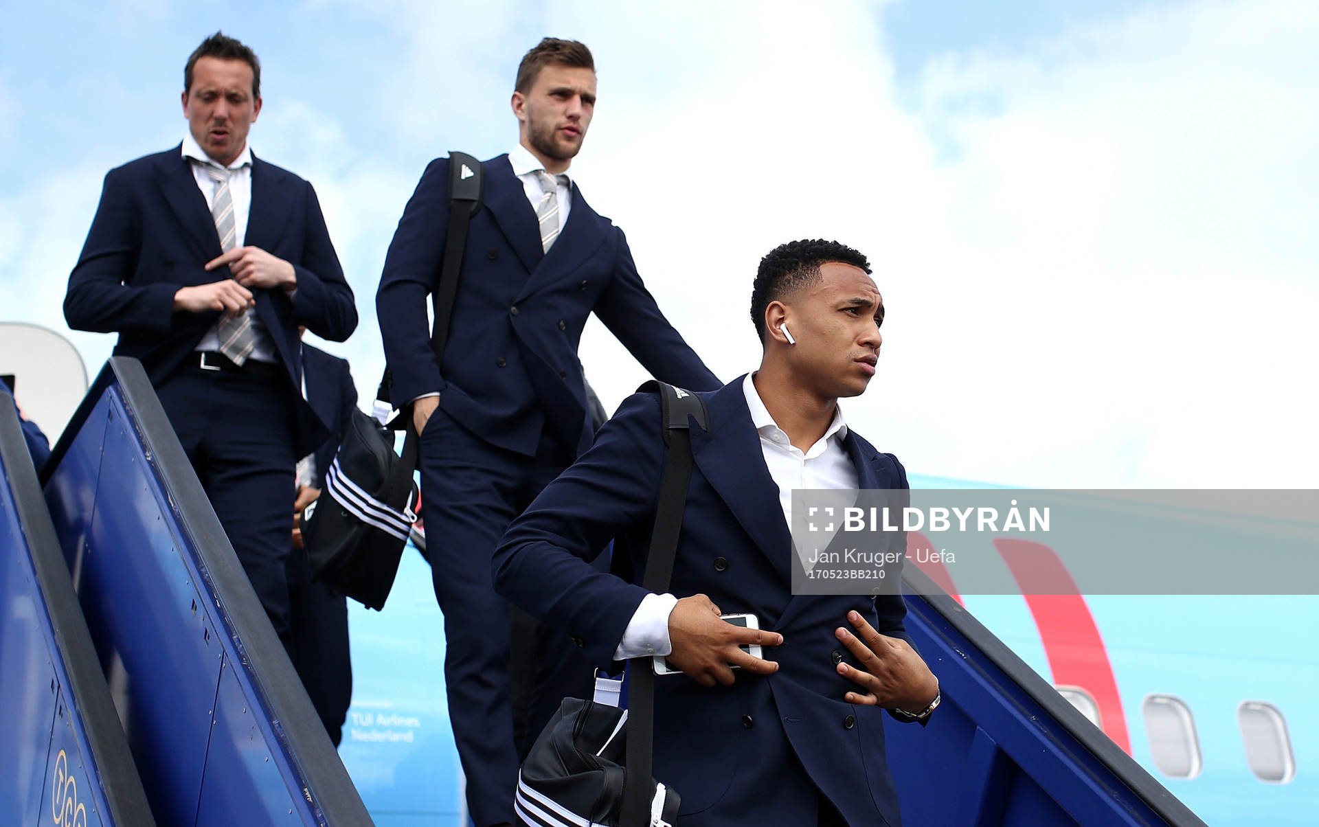Kenny Tete of Ajax arrives with team mates