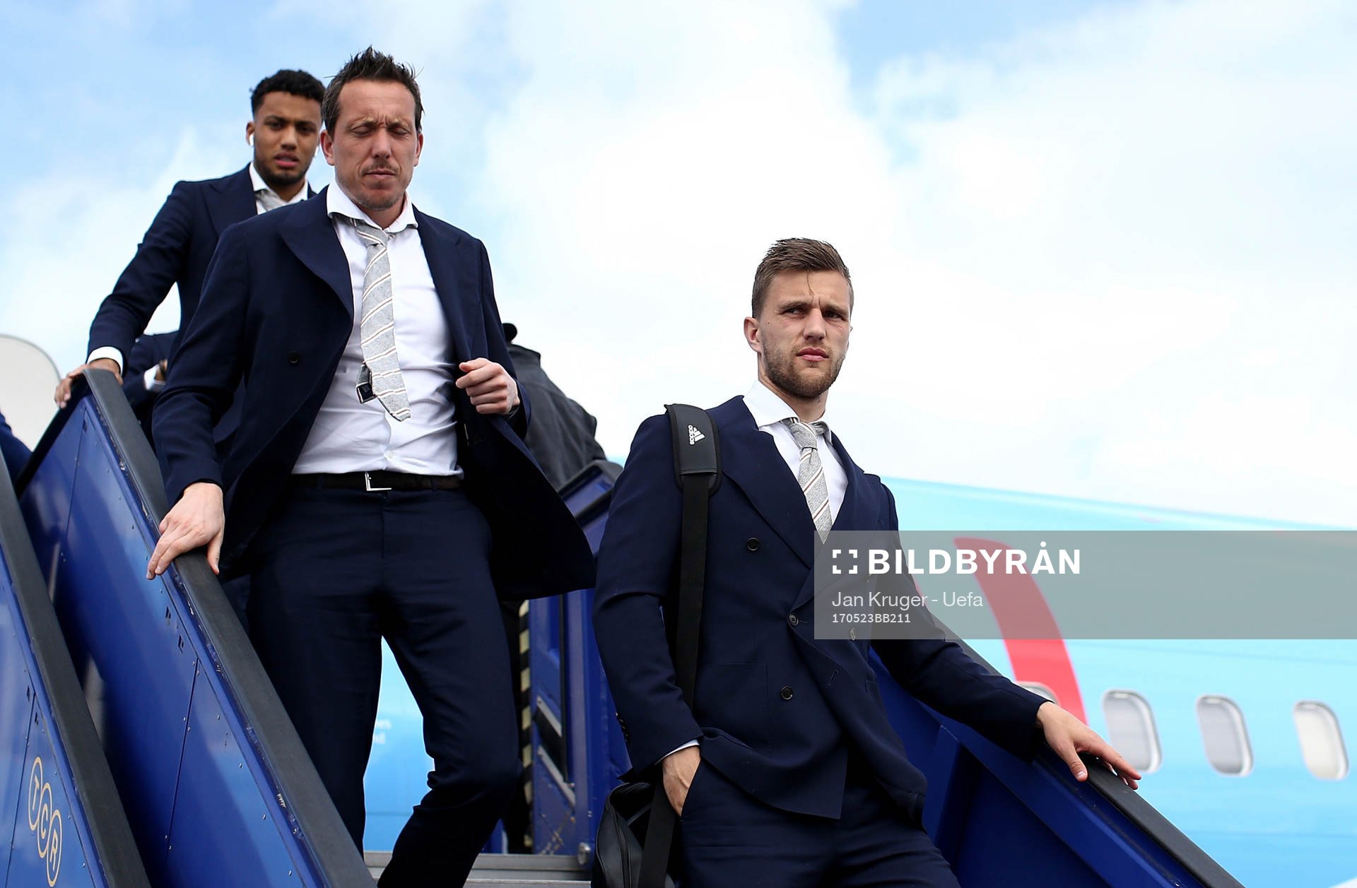 Joel Veltman of Ajax arrives with team mates