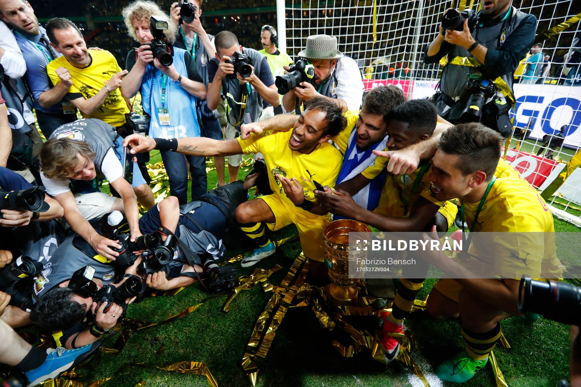 Football Soccer - Eintracht Frankfurt v Borussia Dortmund - DFB-Pokal Final - Olympic Stadium, Berlin, Germany - 27/5/17 Borussia Dortmund's Pierre-Emerick Aubameyang celebrates winning the DFB-Pokal Final with teammates Reuters / Fabrizio Bensch Livepic DFL RULES TO LIMIT THE ONLINE USAGE DURING MATCH TIME TO 15 PICTURES PER GAME. IMAGE SEQUENCES TO SIMULATE VIDEO IS NOT ALLOWED AT ANY TIME. FOR FURTHER QUERIES PLEASE CONTACT DFL DIRECTLY AT + 49 69 650050 DFB RULES PROHIBIT USE IN MMS SERVICES VIA HANDHELD DEVICES UNTIL TWO HOURS AFTER A MATCH AND ANY USAGE ON INTERNET OR ONLINE MEDIA SIMULATING VIDEO FOOTAGE DURING THE MATCH.