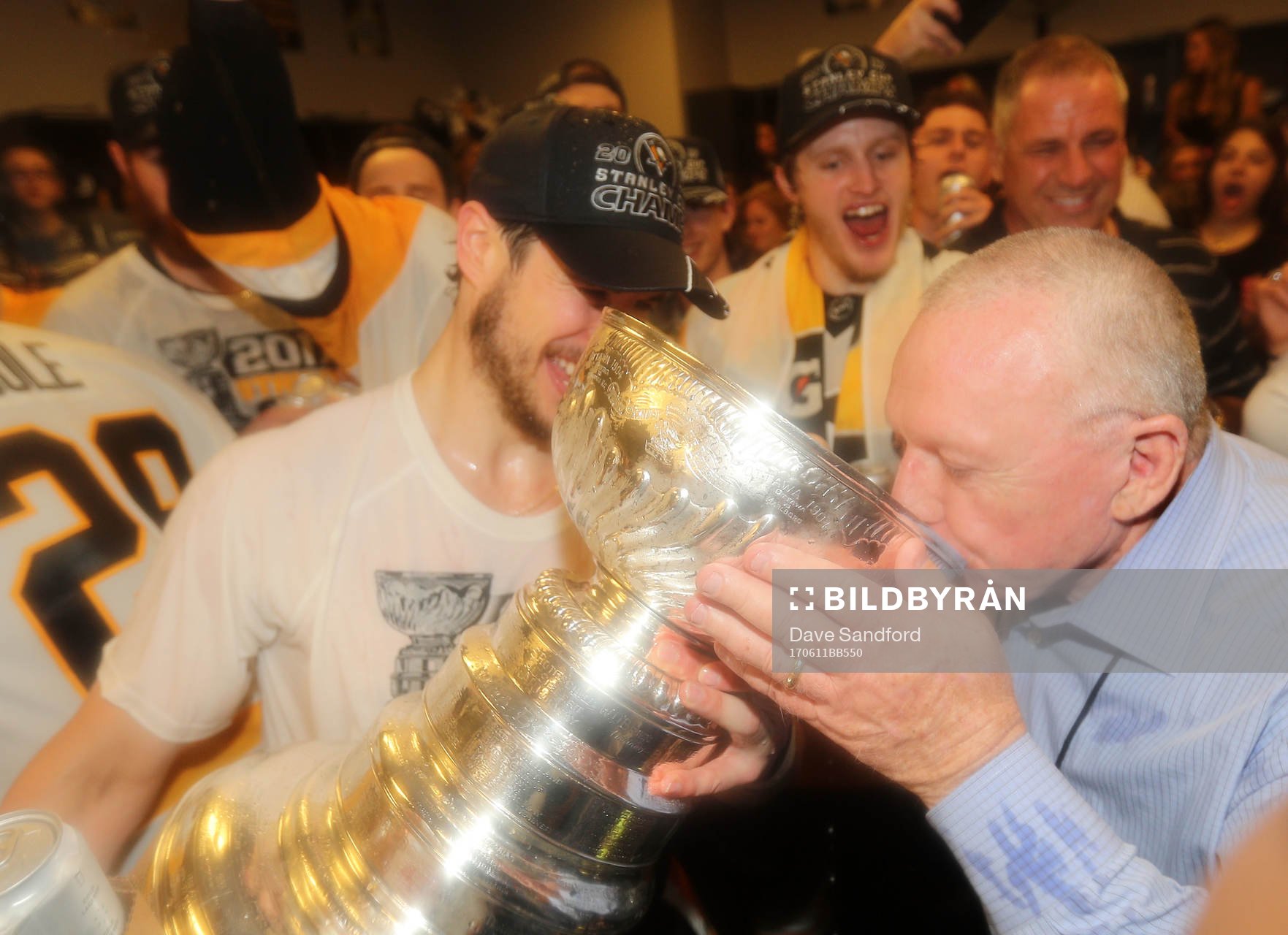 Captain Sidney Crosby #87 of the Pittsburgh Penguins helps