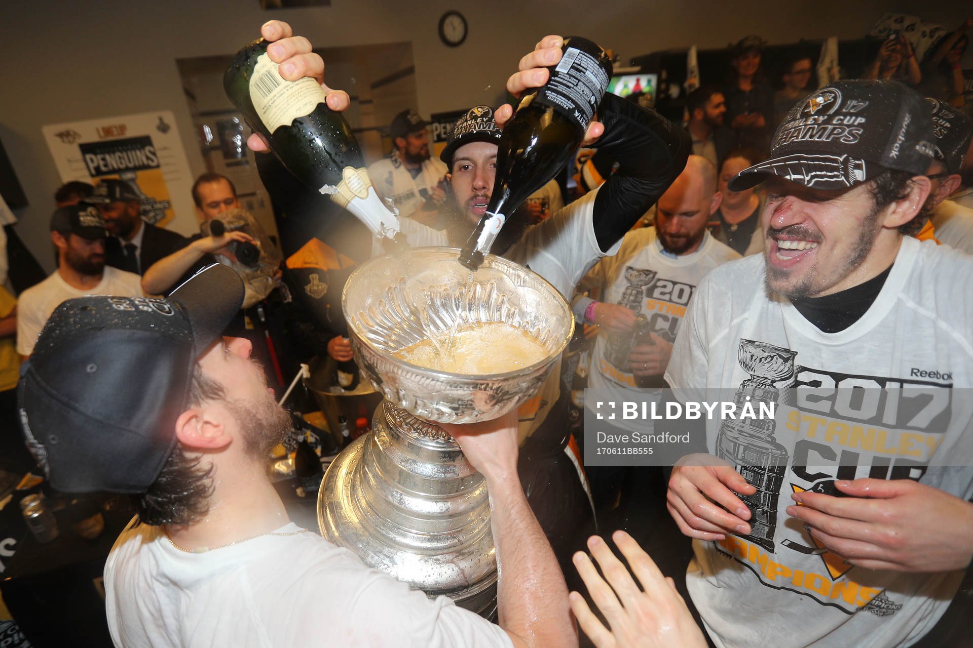 Nick Bonino #13 of the Pittsburgh Penguins pours champagne