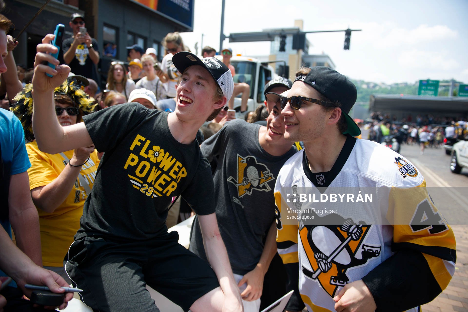 Pittsburgh Penguins' Connor Sheary takes a selfie with a fan