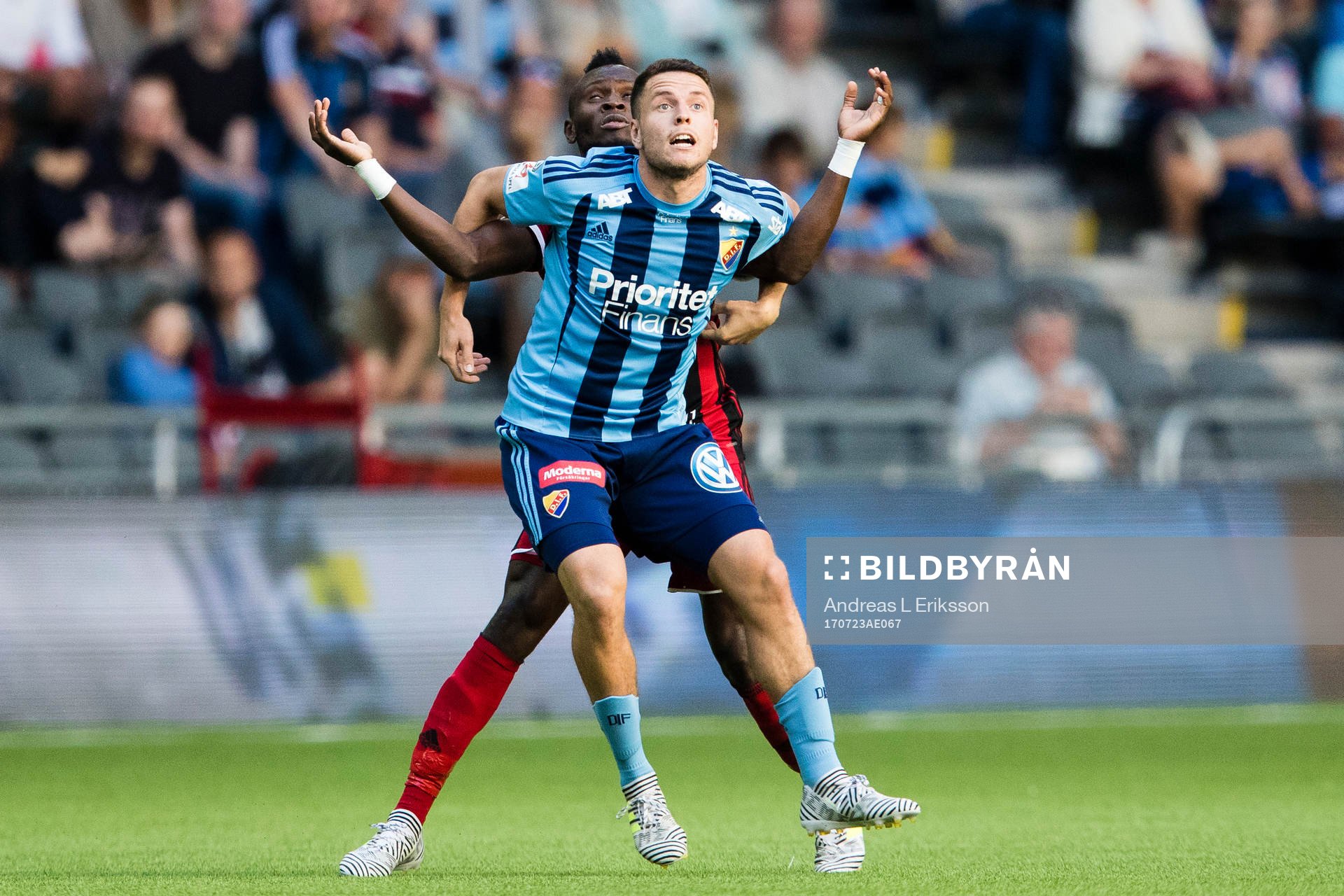 Östersunds Samuel Mensiro i en närkamp med Djurgårdens Kerim Mrabti under fotbollsmatchen i Allsvenskan mellan Djurgården och Östersund den 23 juli 2017 i Stockholm.
