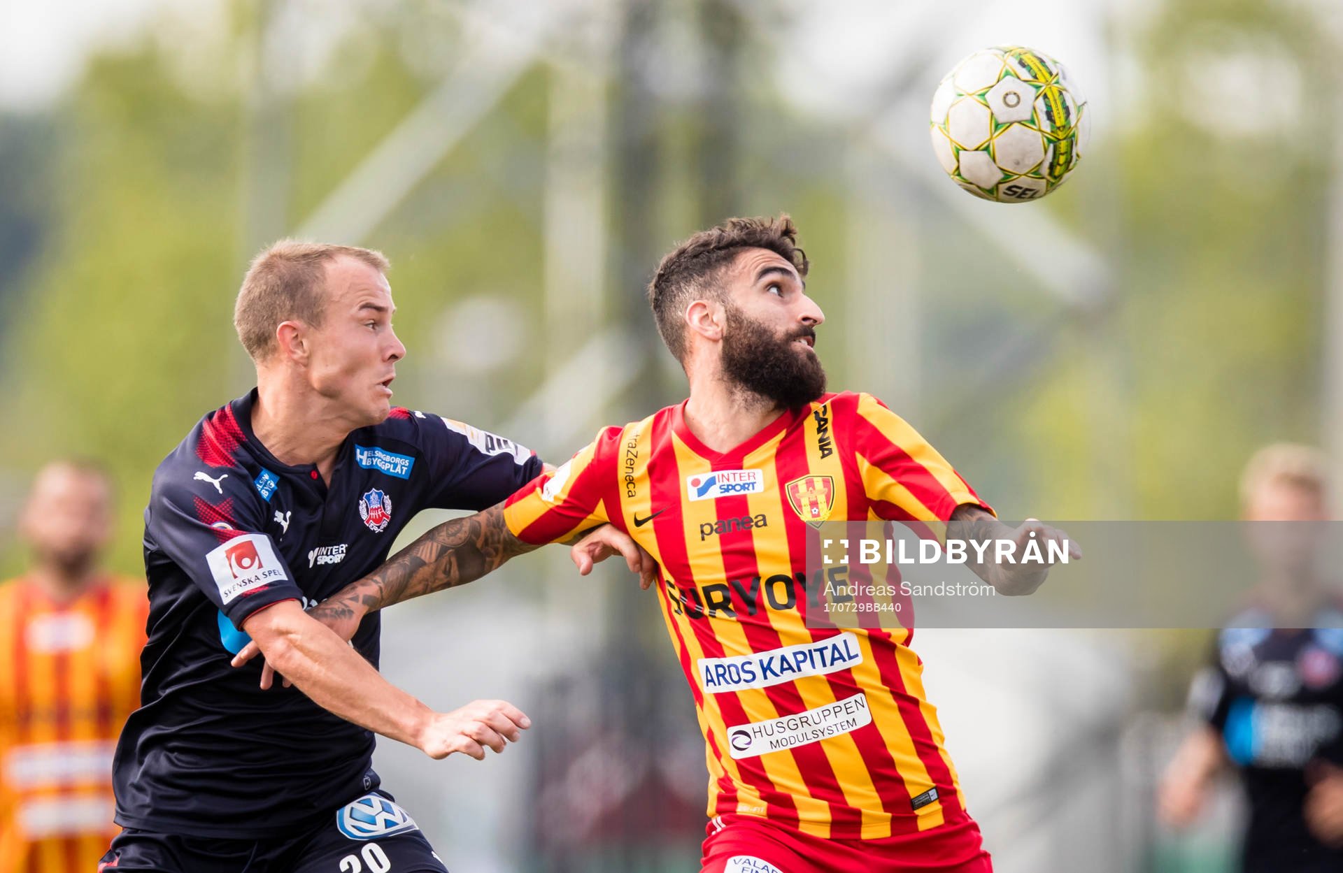 Helsingborgs Carl Wede i kamp om bollen med Syrianskas Charbel Georges under fotbollsmatchen i Superettan mellan Syrianska och Helsingborg den 29 Juli 2017 i Södertälje.