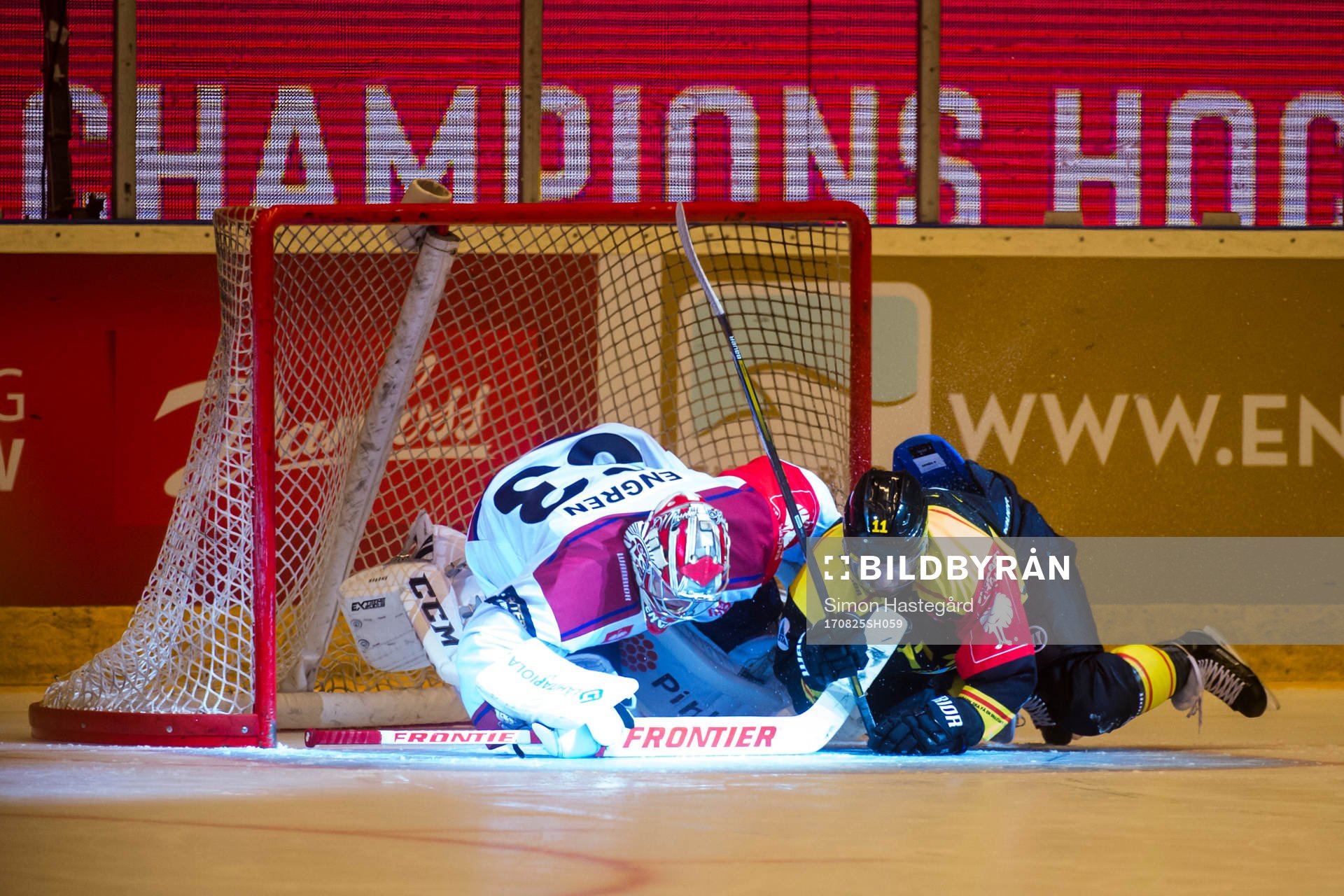 Kevin Clark of Brynäs collides with Goalkeeper Atte Engren