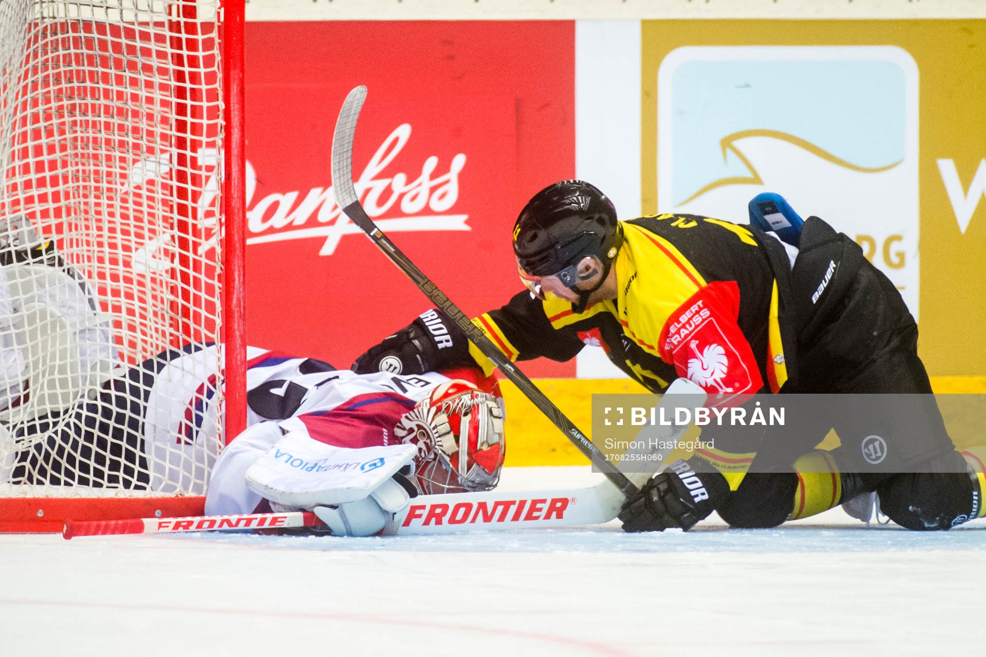 Kevin Clark of Brynäs and Goalkeeper Atte Engren of
