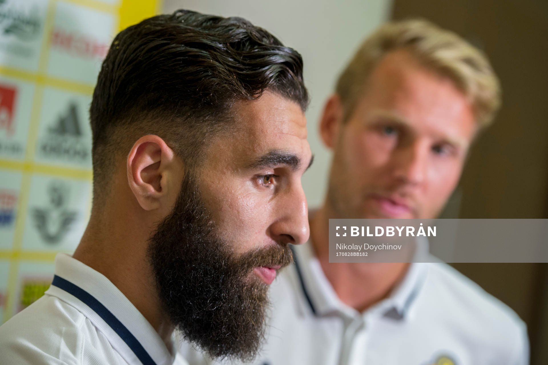 Swedish player Jimmy Durmaz (l) and Ola Toivonen meet media